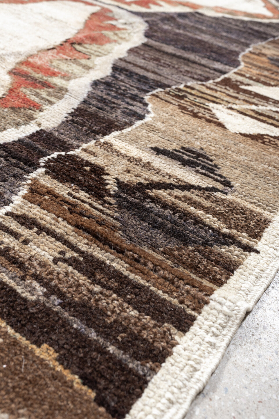 8' x 9' one-of-a-kind handmade antique Kars rug. Color palette: brown, ivory, taupe, charcoal, camel, coral, slate, cream