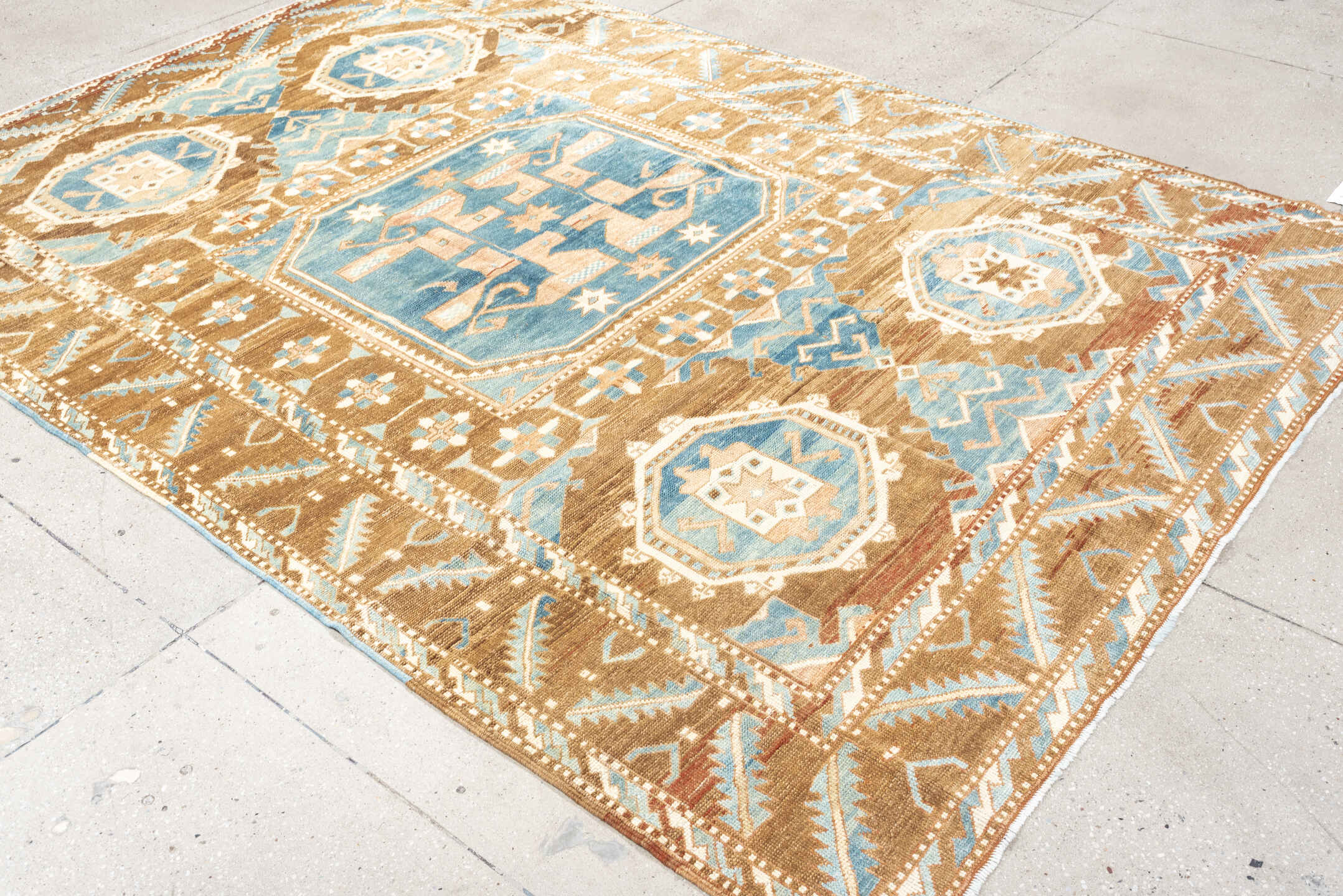 6' x 9' one-of-a-kind handmade antique Kars medium size rug. Color palette: camel, sky blue, ivory, taupe, blush