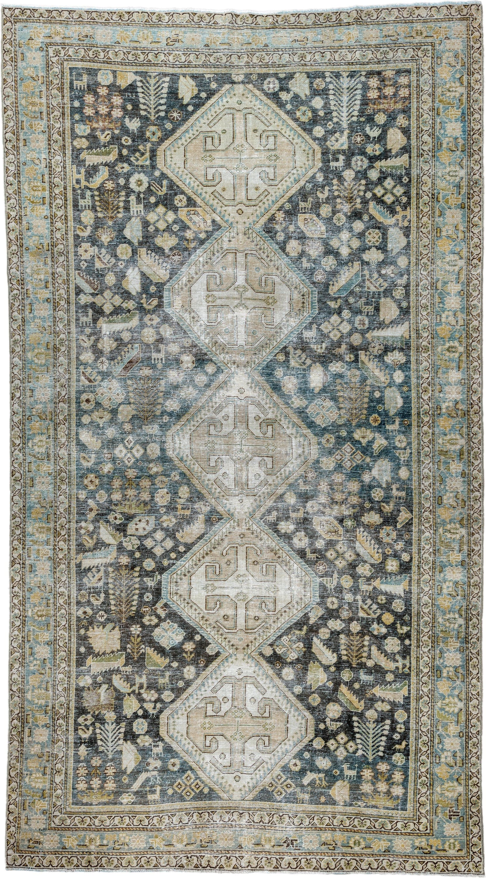 5' x 9' one-of-a-kind handmade antique Qashqai medium size rug. Color palette: charcoal, ivory, sky blue, taupe, beige