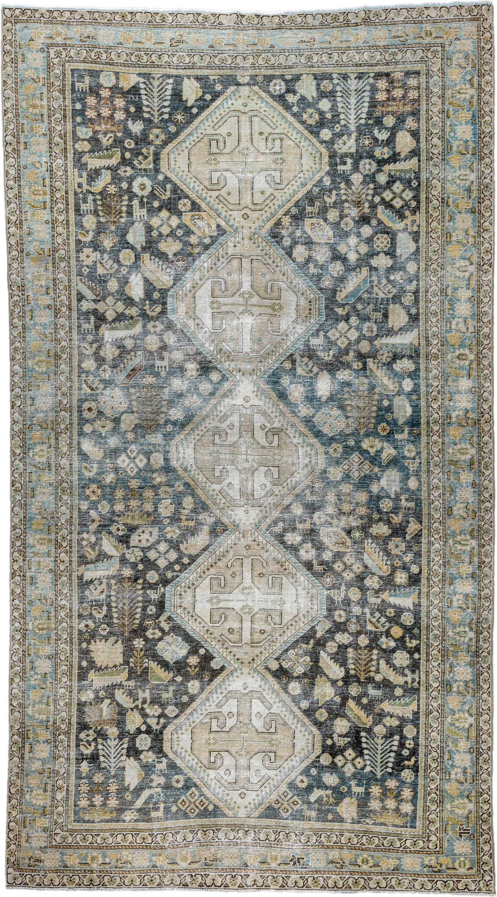 5' x 9' one-of-a-kind handmade antique Qashqai medium size rug. Color palette: charcoal, ivory, sky blue, taupe, beige