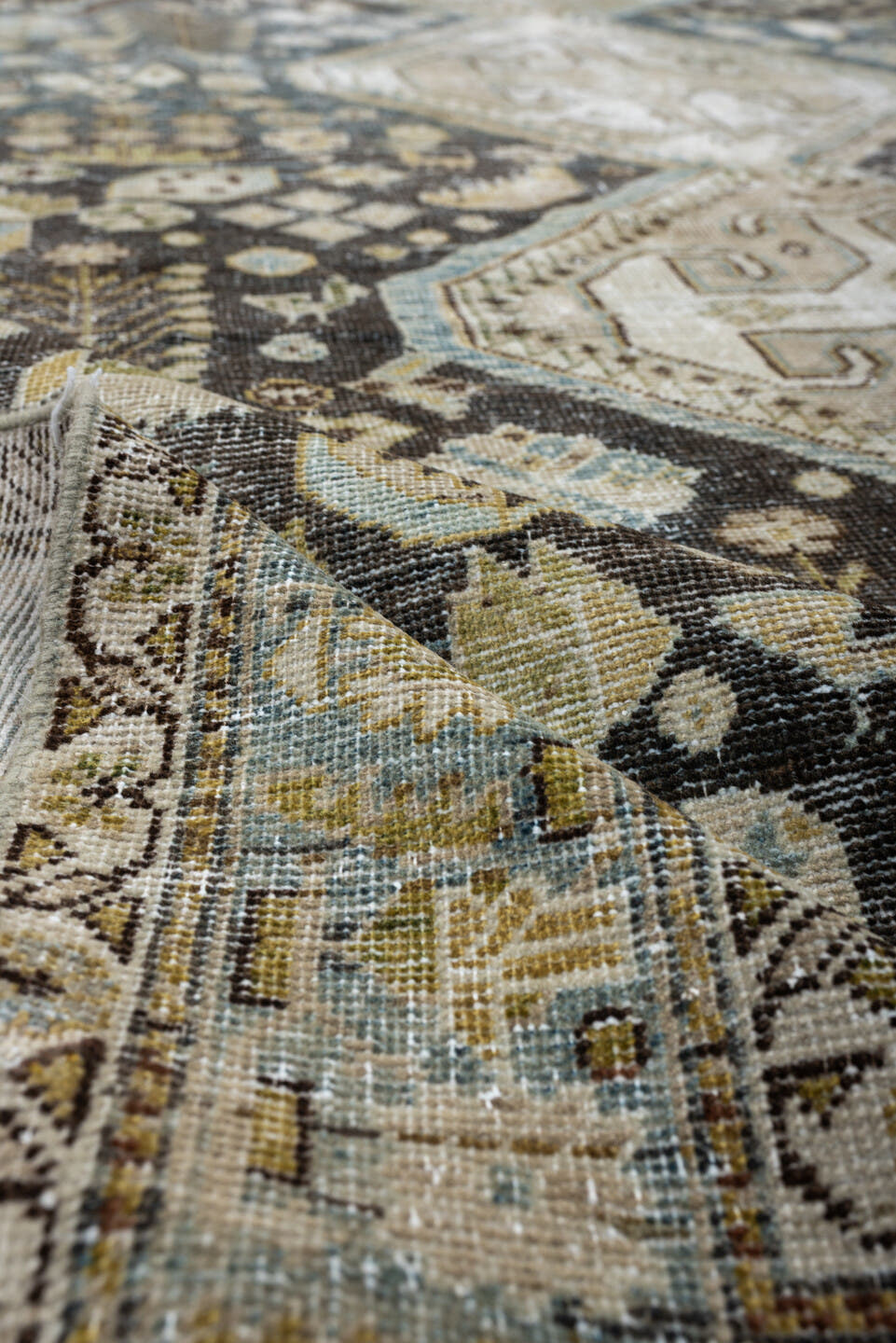5' x 9' one-of-a-kind handmade antique Qashqai medium size rug. Color palette: charcoal, ivory, sky blue, taupe, beige