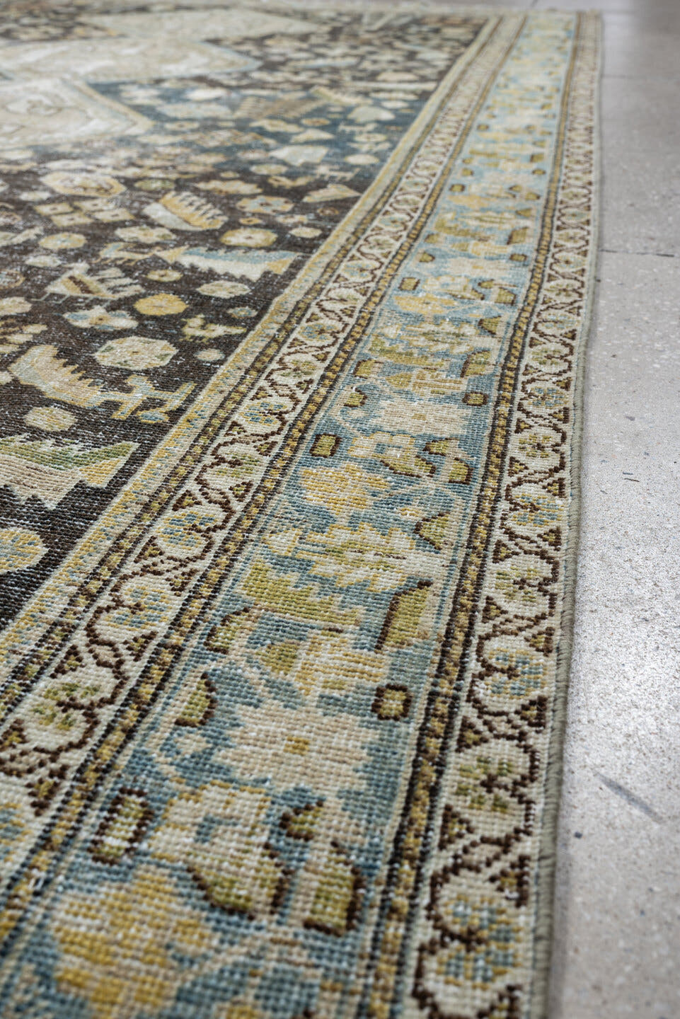5' x 9' one-of-a-kind handmade antique Qashqai medium size rug. Color palette: charcoal, ivory, sky blue, taupe, beige