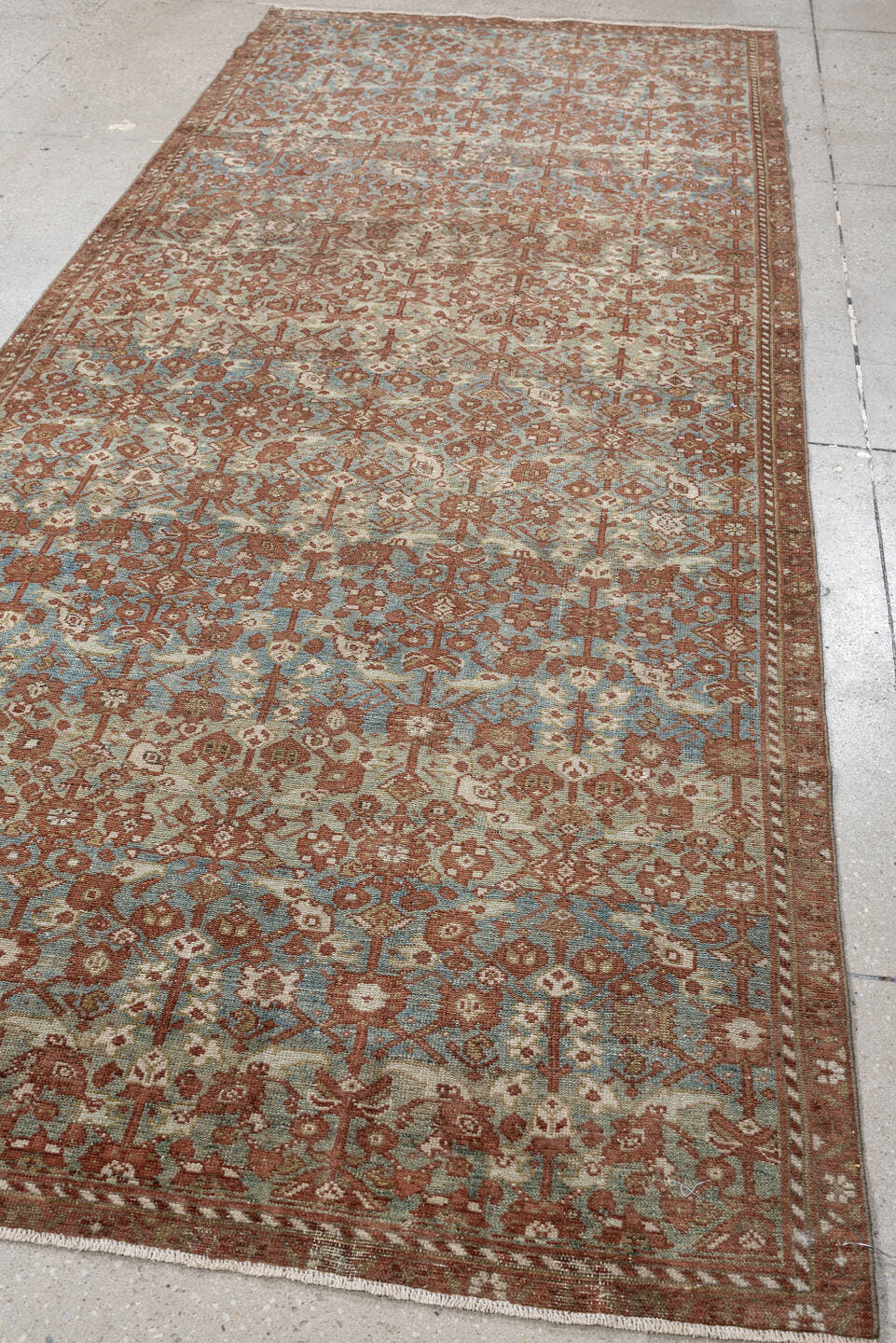 4' x 10' one-of-a-kind handmade antique Malayer runner rug. Color palette: rust, sky blue, ivory, camel, taupe, terracotta
