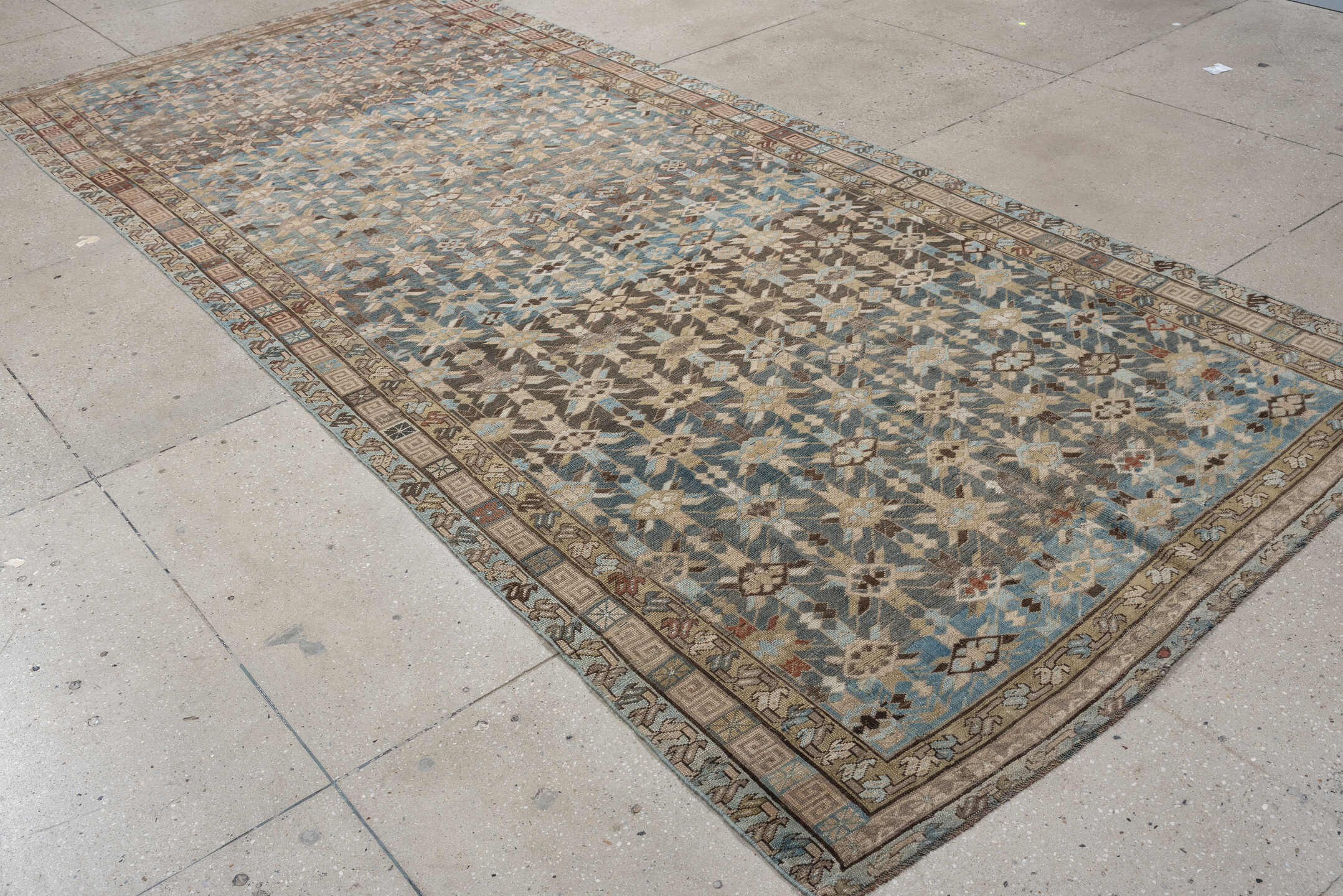 5' x 12' one-of-a-kind handmade antique Kurd rug. Color palette: sky blue, taupe, ivory, brown, beige, rust, light blue