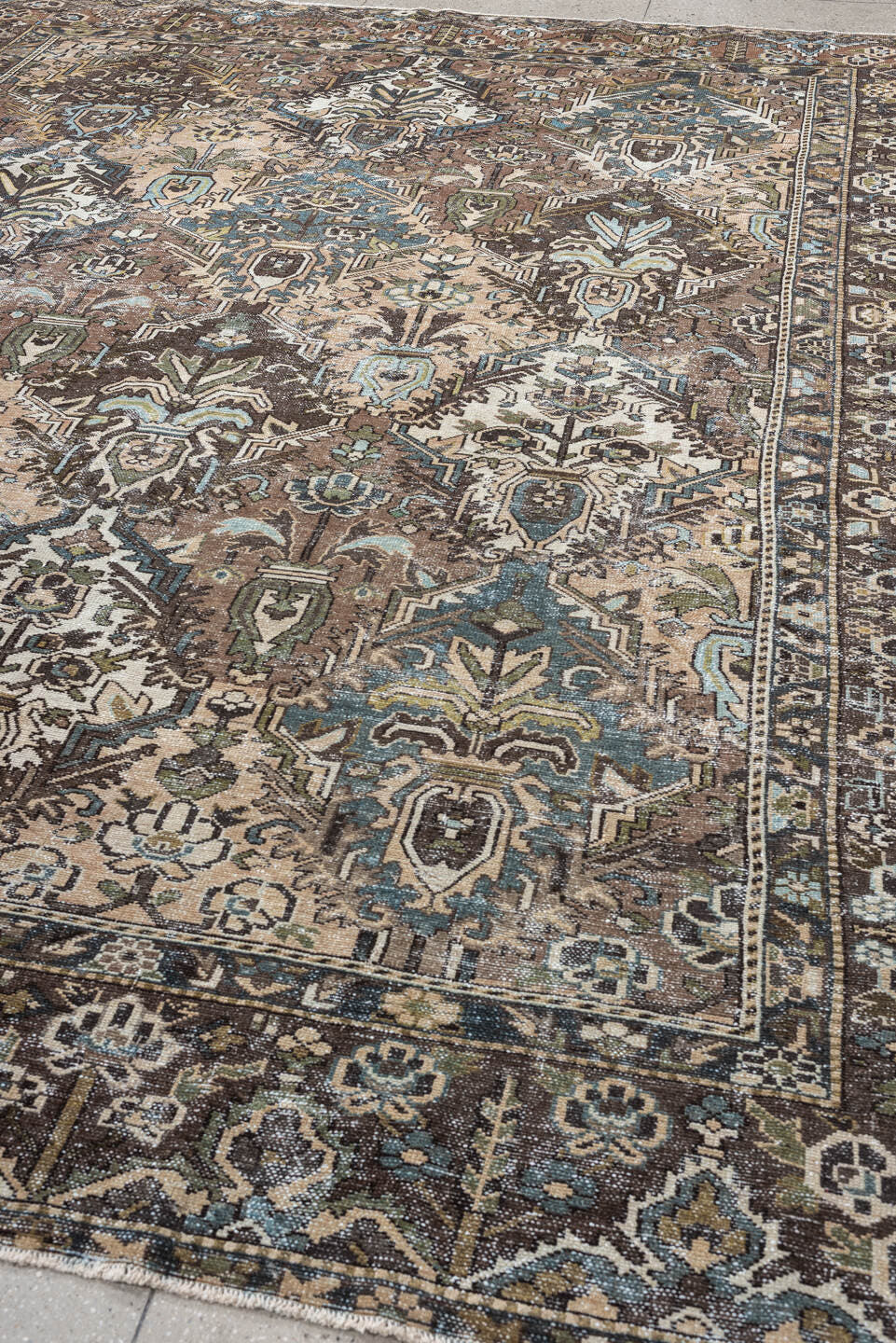 10' x 13' one-of-a-kind handmade antique Baktiary oversize rug. Color palette: brown, taupe, sky blue, ivory, sage, charcoal