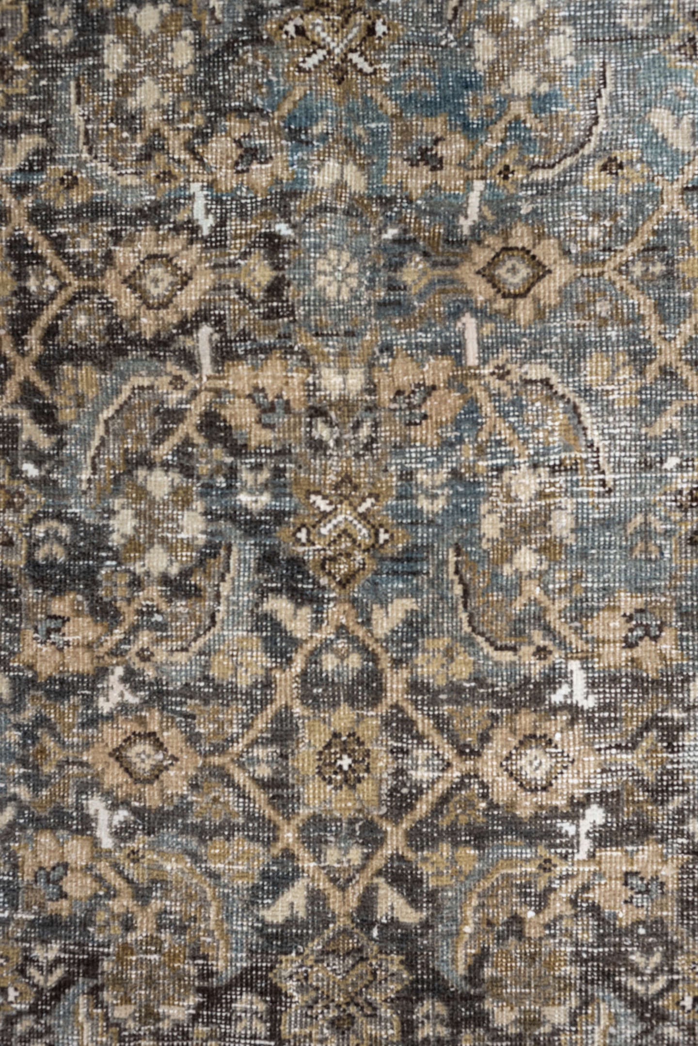 5' x 9' one-of-a-kind handmade antique Shiraz medium size rug. Color palette: taupe, brown, blue, ivory, charcoal, camel
