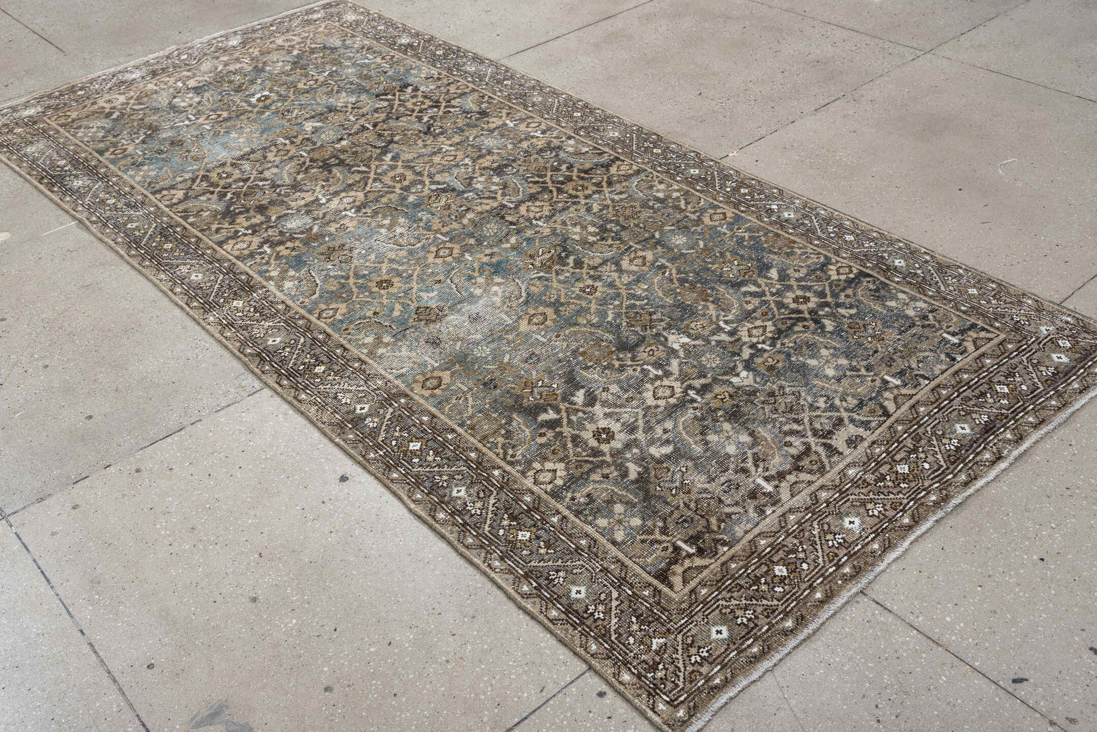 5' x 9' one-of-a-kind handmade antique Shiraz medium size rug. Color palette: taupe, brown, blue, ivory, charcoal, camel