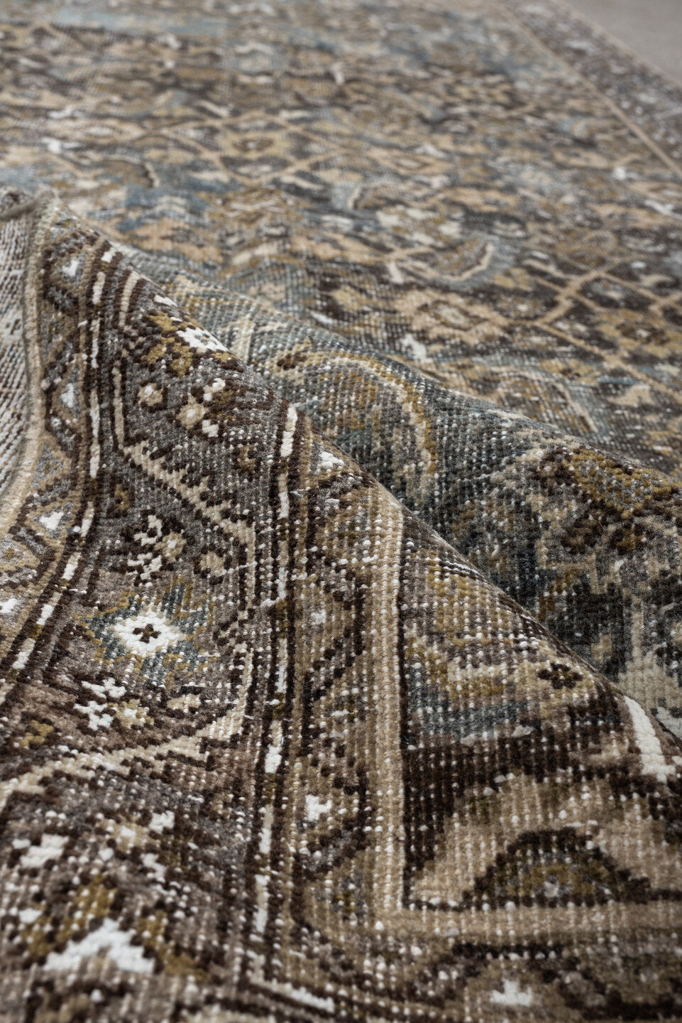5' x 9' one-of-a-kind handmade antique Shiraz medium size rug. Color palette: taupe, brown, blue, ivory, charcoal, camel