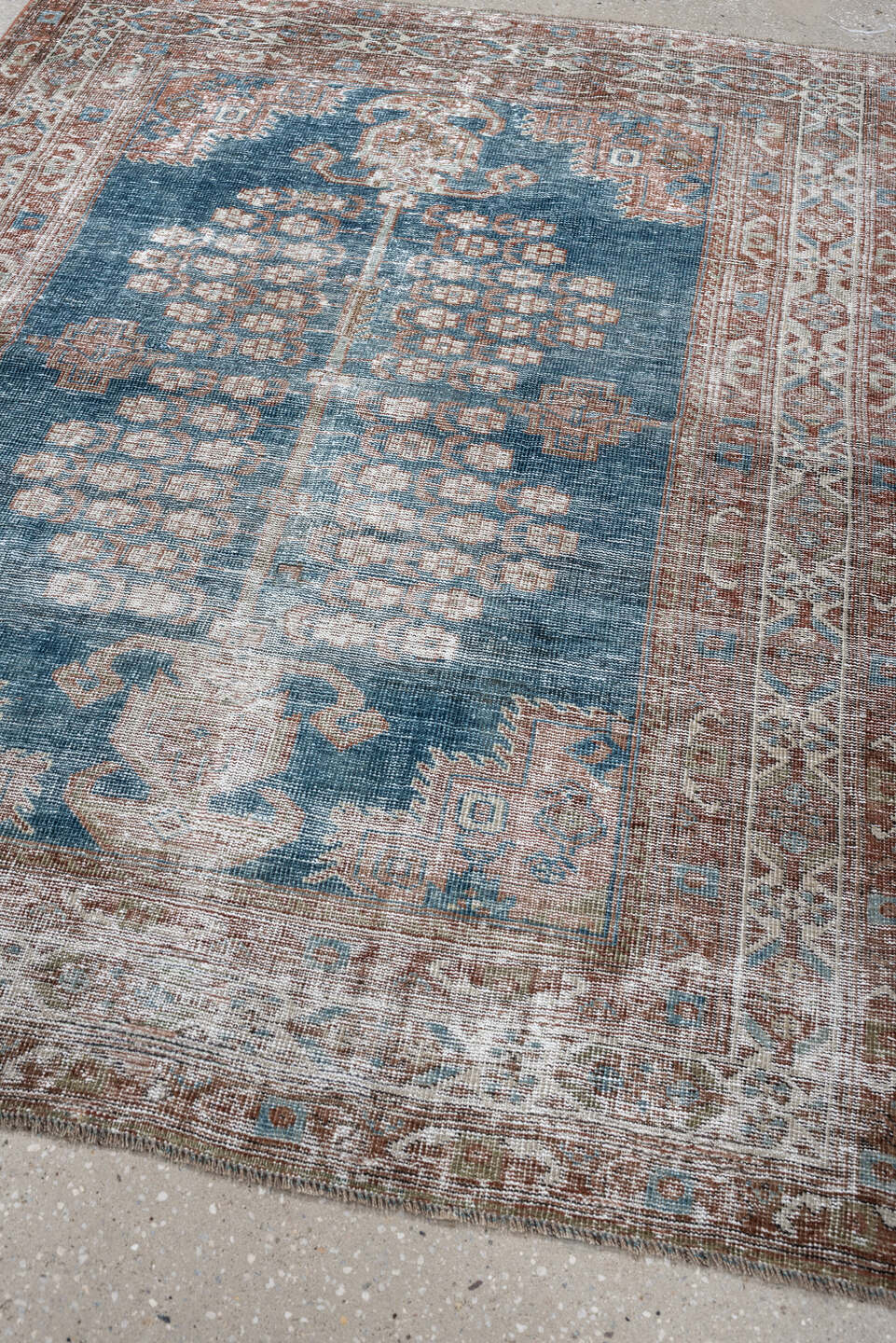 4' x 5' one-of-a-kind handmade antique Shiraz small size rug. Color palette: blue, rust, ivory, taupe, camel, terracotta