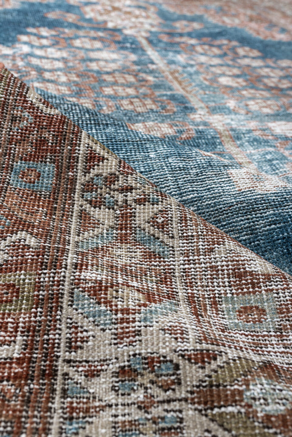 4' x 5' one-of-a-kind handmade antique Shiraz small size rug. Color palette: blue, rust, ivory, taupe, camel, terracotta