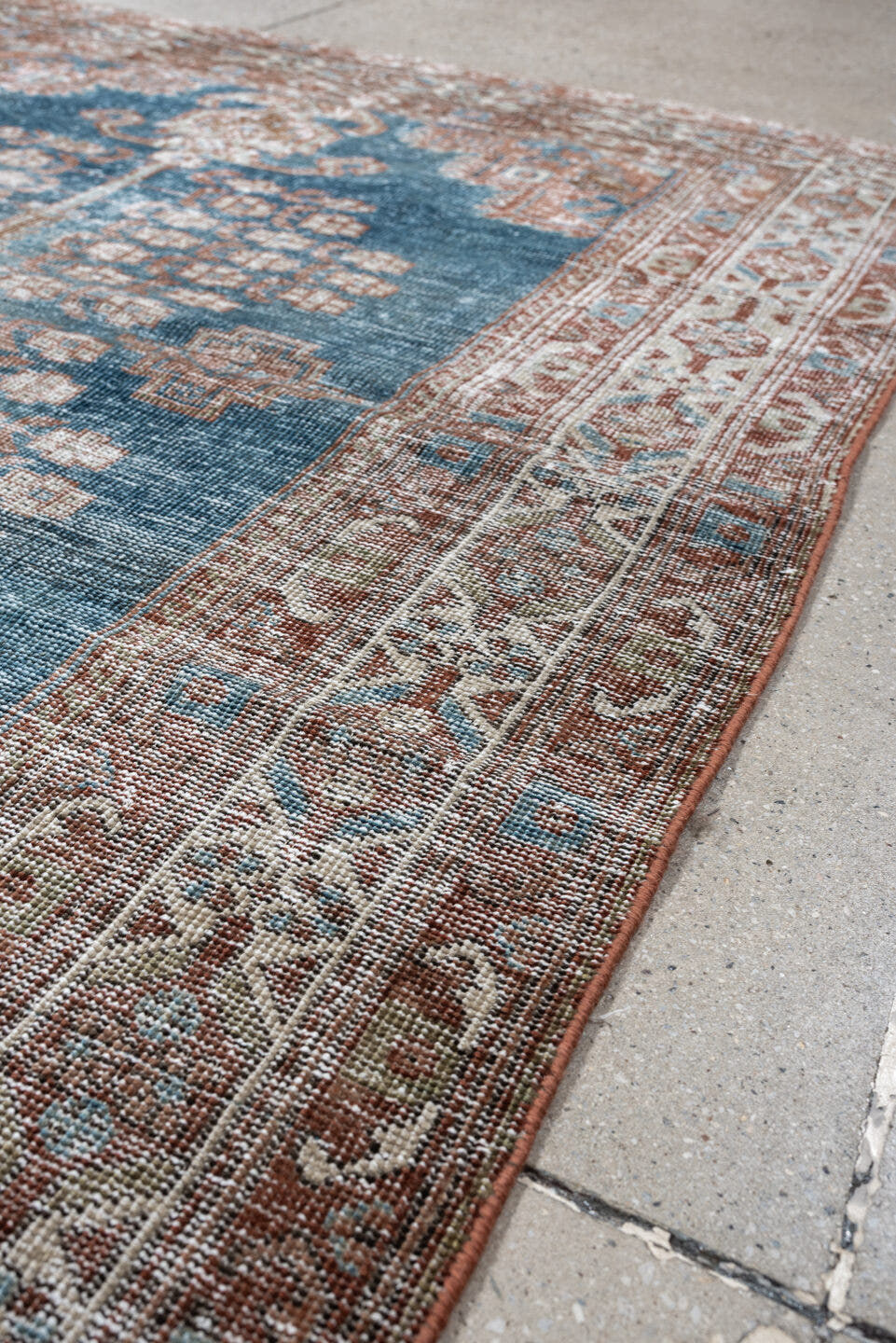 4' x 5' one-of-a-kind handmade antique Shiraz small size rug. Color palette: blue, rust, ivory, taupe, camel, terracotta