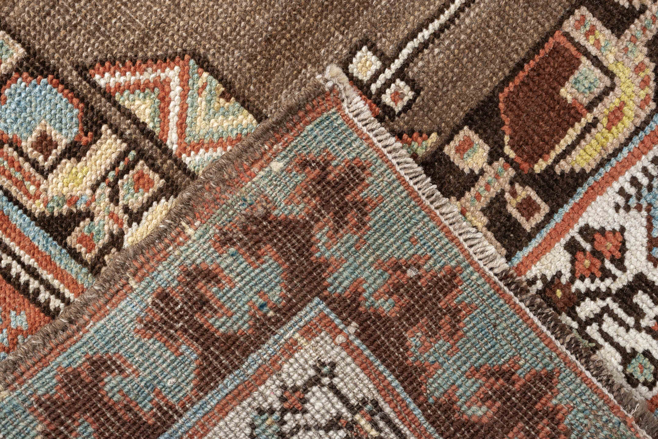 3' x 11' one-of-a-kind handmade antique Sarab runner rug. Color palette: brown, ivory, rust, sky blue, camel, terra cotta