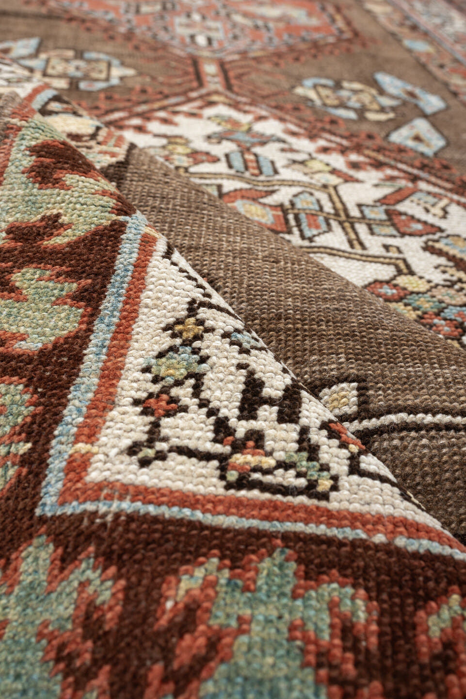 3' x 11' one-of-a-kind handmade antique Sarab runner rug. Color palette: brown, ivory, rust, sky blue, camel, terra cotta