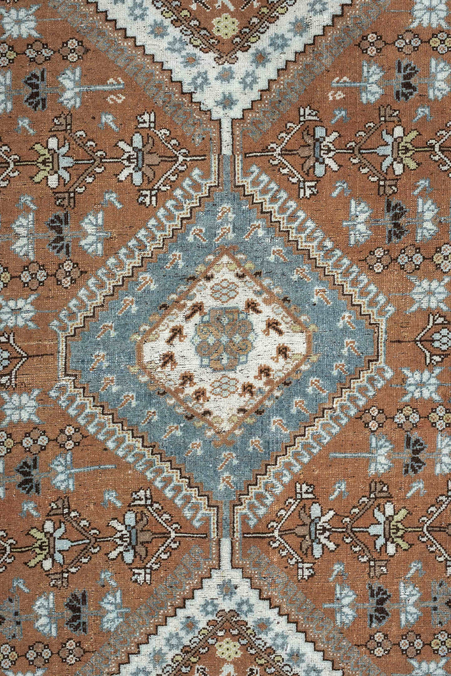 6' x 9' one-of-a-kind handmade antique Shiraz rug. Color palette: terra cotta, sky blue, ivory, camel, charcoal, sage, taupe