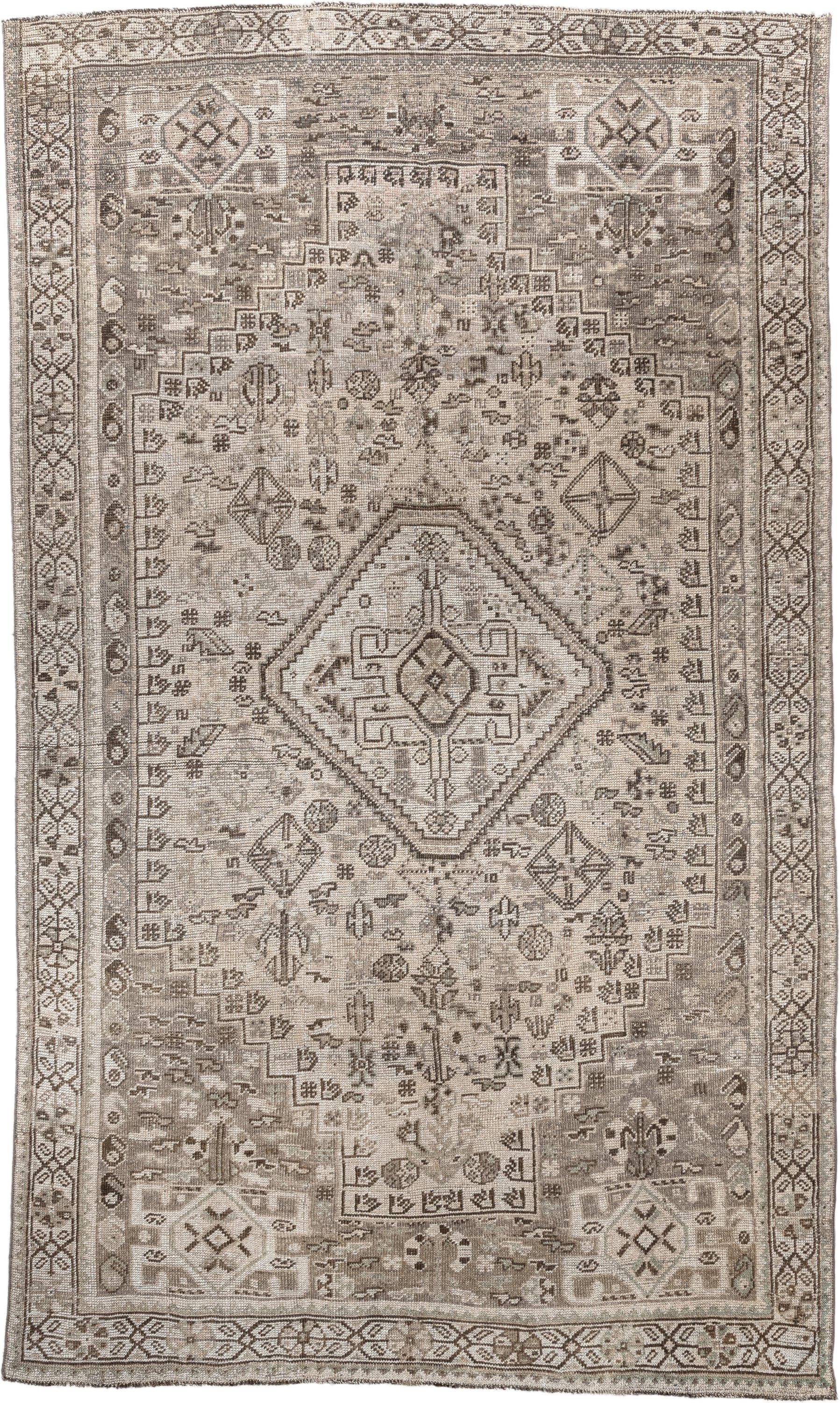 4' x 8' one-of-a-kind handmade antique Shiraz medium size rug. Color palette: taupe, ivory, brown, gray, beige