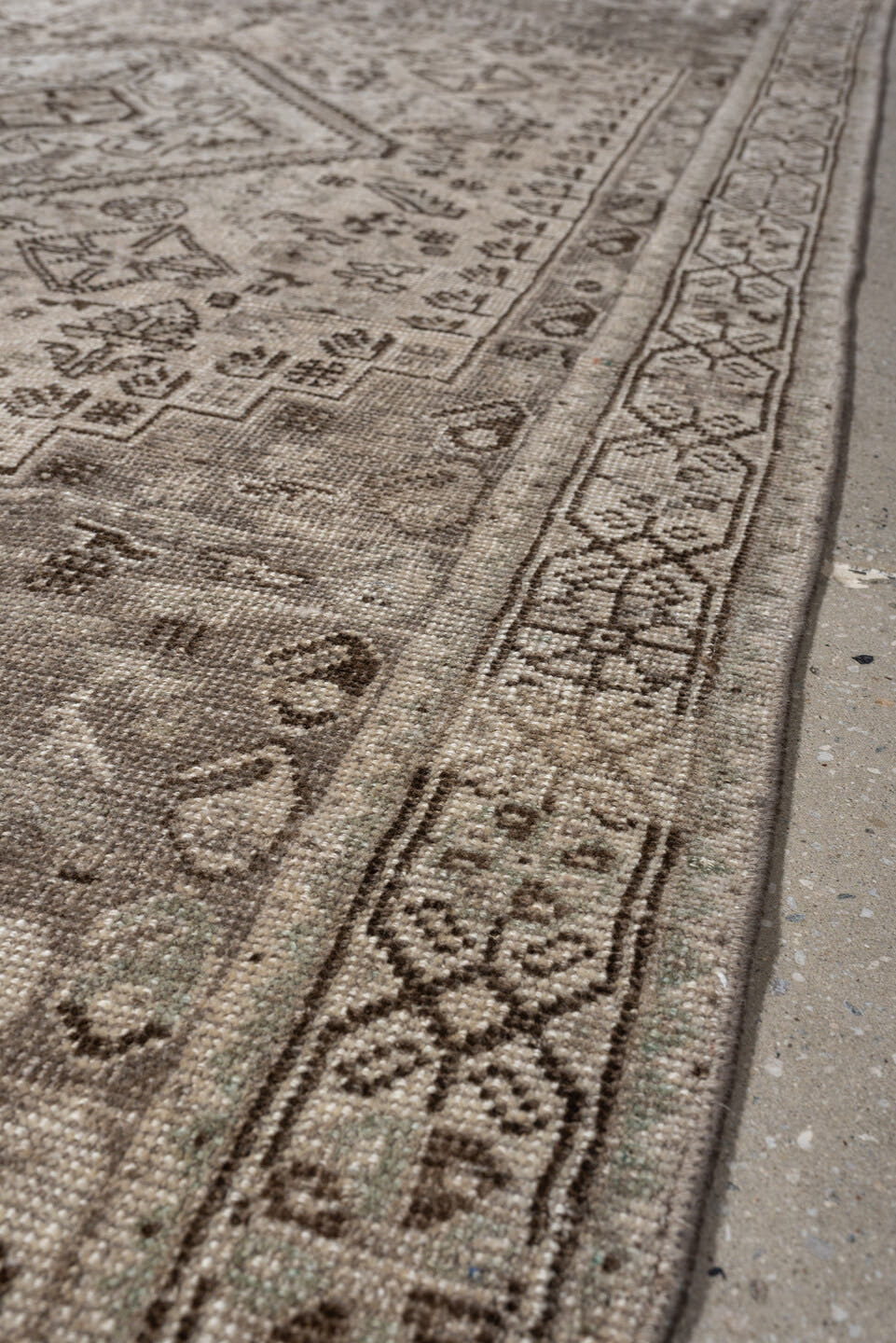 4' x 8' one-of-a-kind handmade antique Shiraz medium size rug. Color palette: taupe, ivory, brown, gray, beige