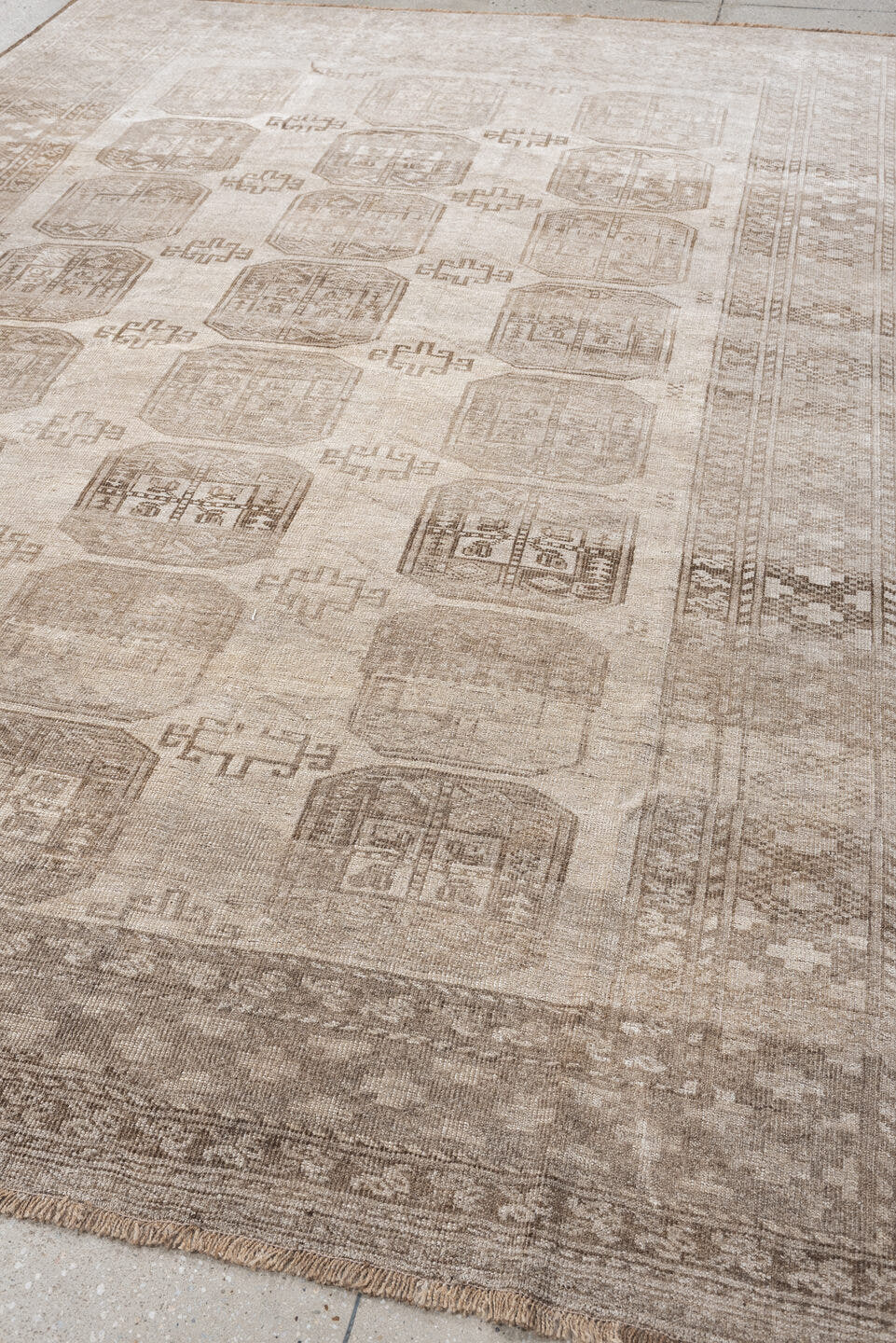 7' x 10' one-of-a-kind handmade antique Afghan large size rug. Color palette: taupe, beige, camel, ivory, brown, gray