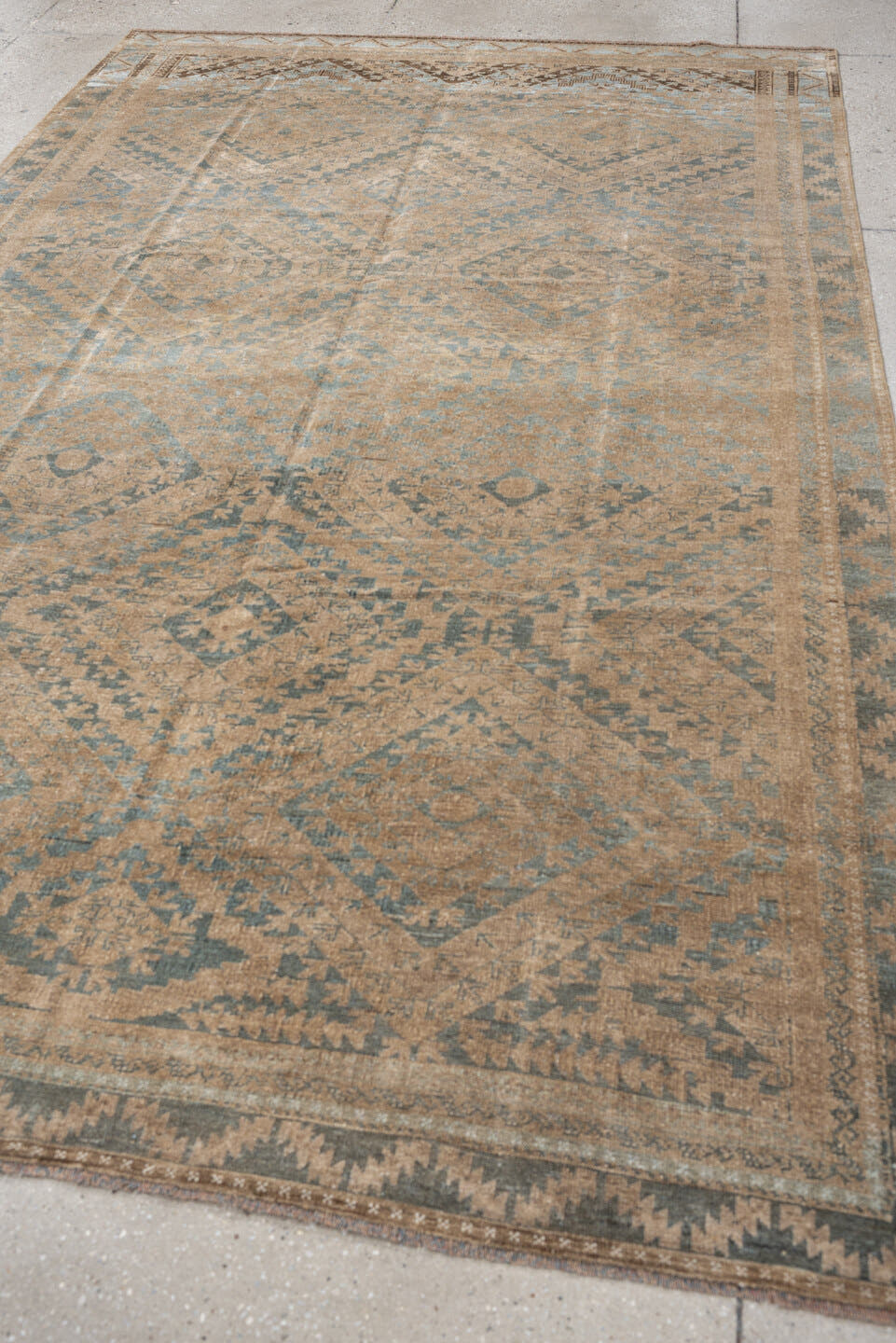 6' x 9' one-of-a-kind handmade antique Belouch large size rug. Color palette: camel, taupe, slate, pale blue, beige, brown