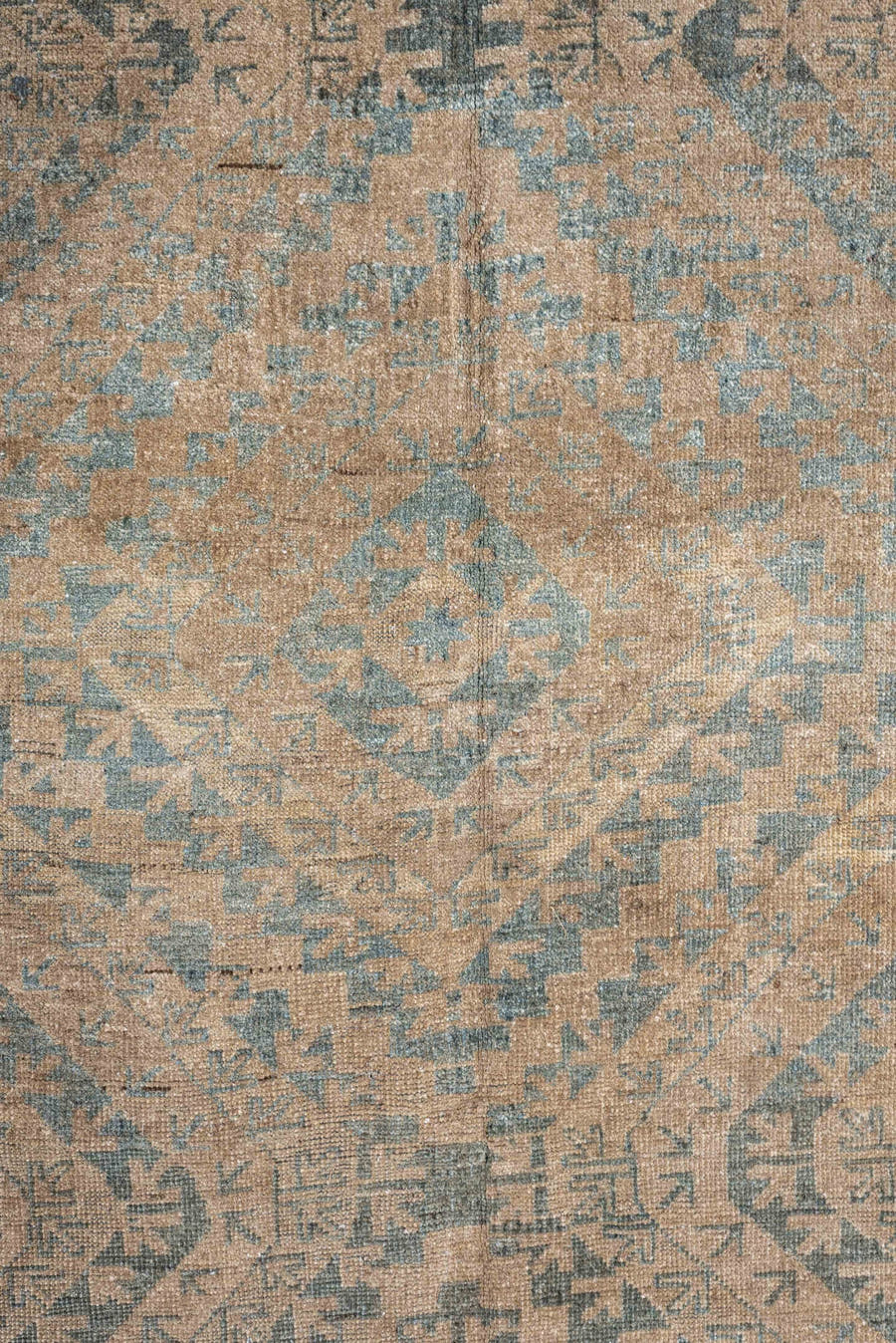6' x 9' one-of-a-kind handmade antique Belouch large size rug. Color palette: camel, taupe, slate, pale blue, beige, brown