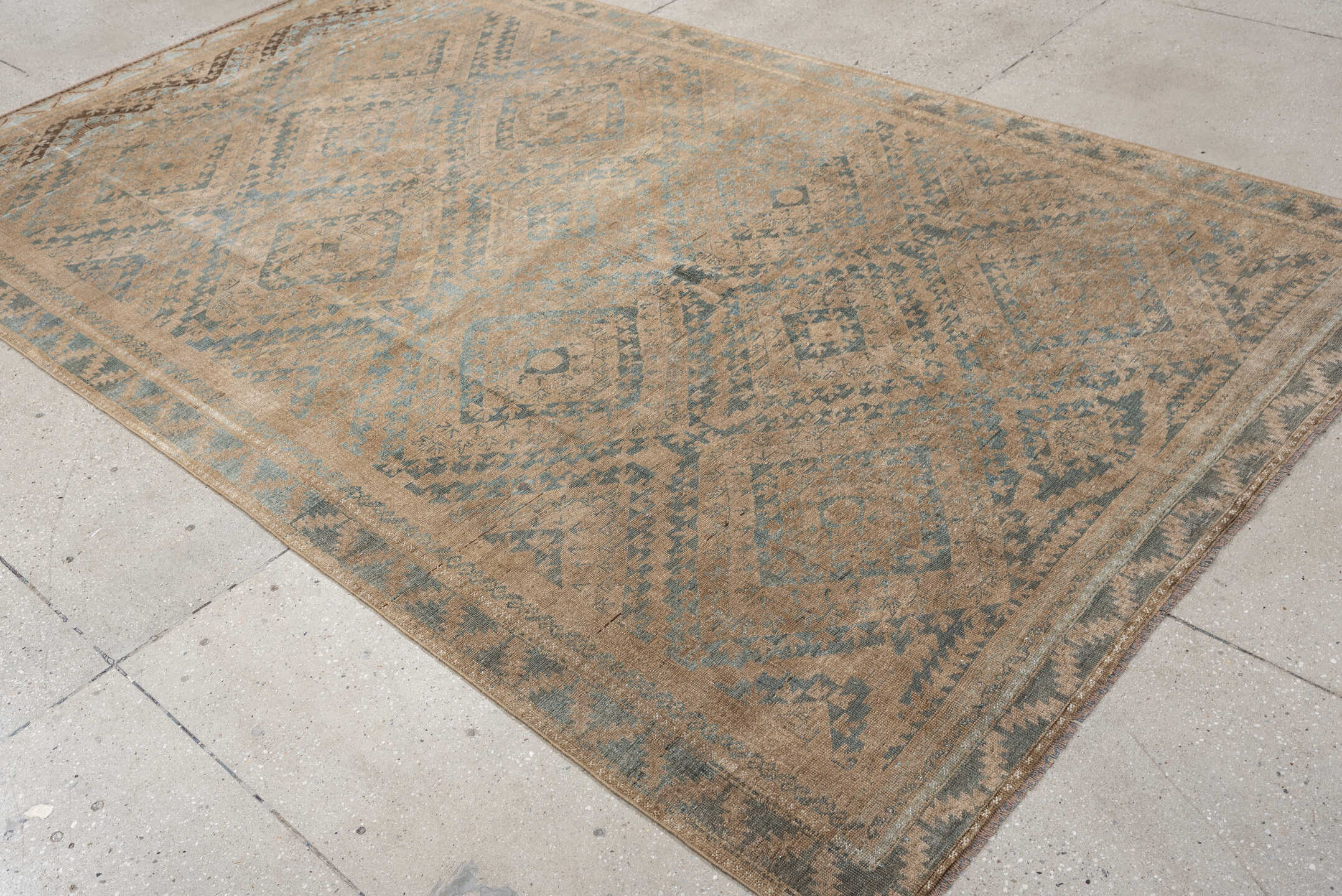 6' x 9' one-of-a-kind handmade antique Belouch large size rug. Color palette: camel, taupe, slate, pale blue, beige, brown