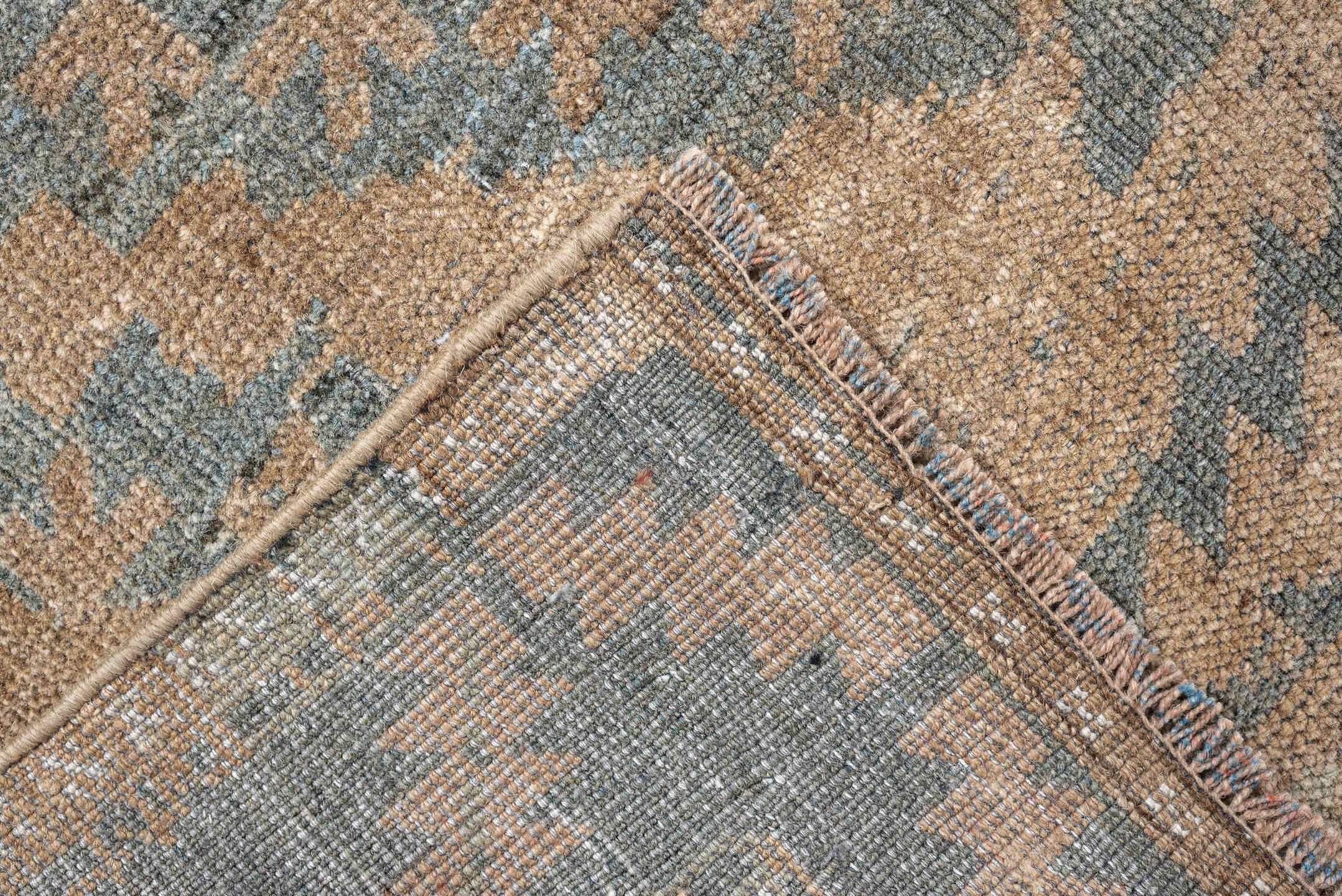 6' x 9' one-of-a-kind handmade antique Belouch large size rug. Color palette: camel, taupe, slate, pale blue, beige, brown
