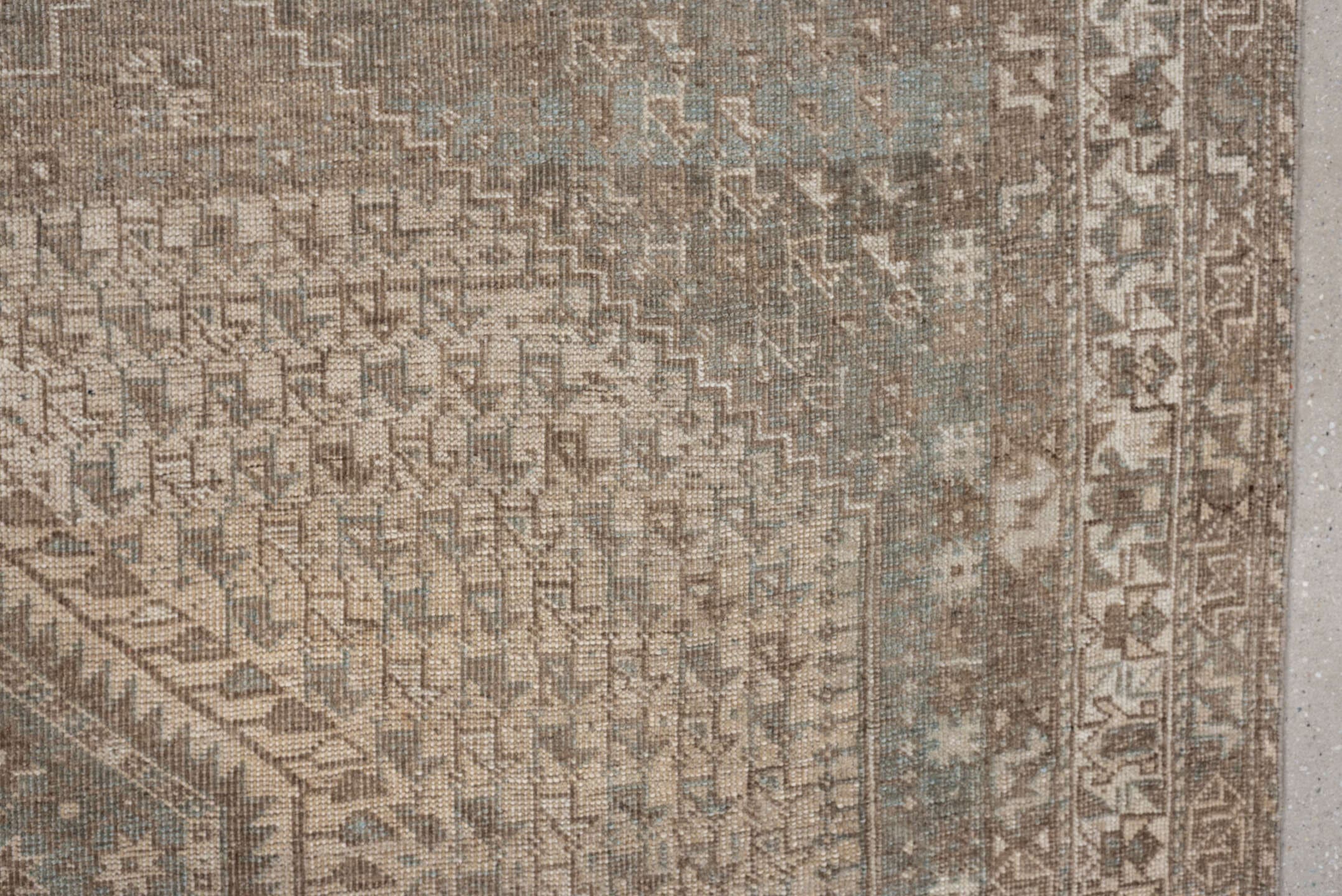 6' x 9' one-of-a-kind handmade antique Shiraz rug. Color palette: taupe, ivory, pale blue, beige, sand, camel, gray