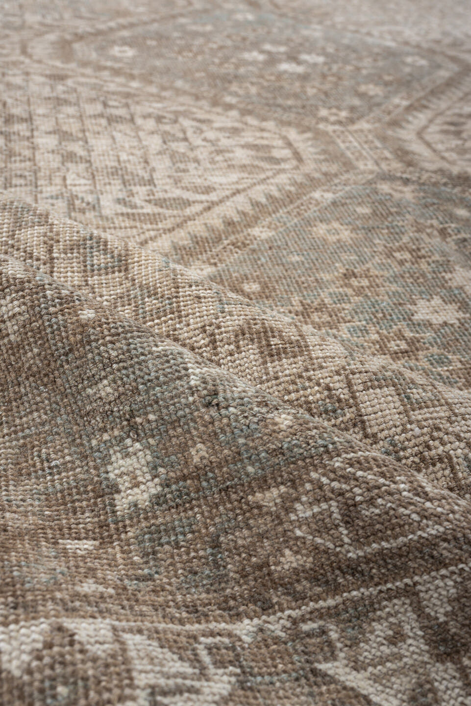 6' x 9' one-of-a-kind handmade antique Shiraz rug. Color palette: taupe, ivory, pale blue, beige, sand, camel, gray