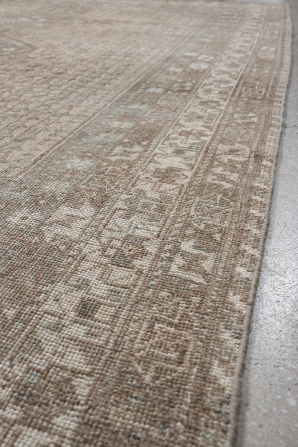 6' x 9' one-of-a-kind handmade antique Shiraz rug. Color palette: taupe, ivory, pale blue, beige, sand, camel, gray