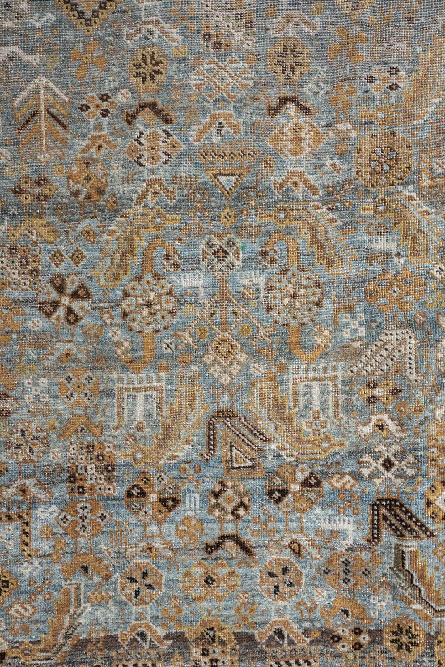 4' x 6' one-of-a-kind handmade antique Shiraz rug. Color palette: sky blue, camel, ivory, taupe, brown, slate, gold