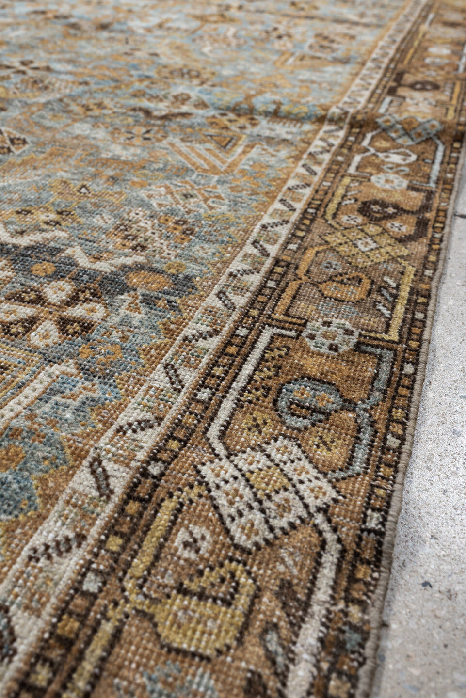 4' x 6' one-of-a-kind handmade antique Shiraz rug. Color palette: sky blue, camel, ivory, taupe, brown, slate, gold