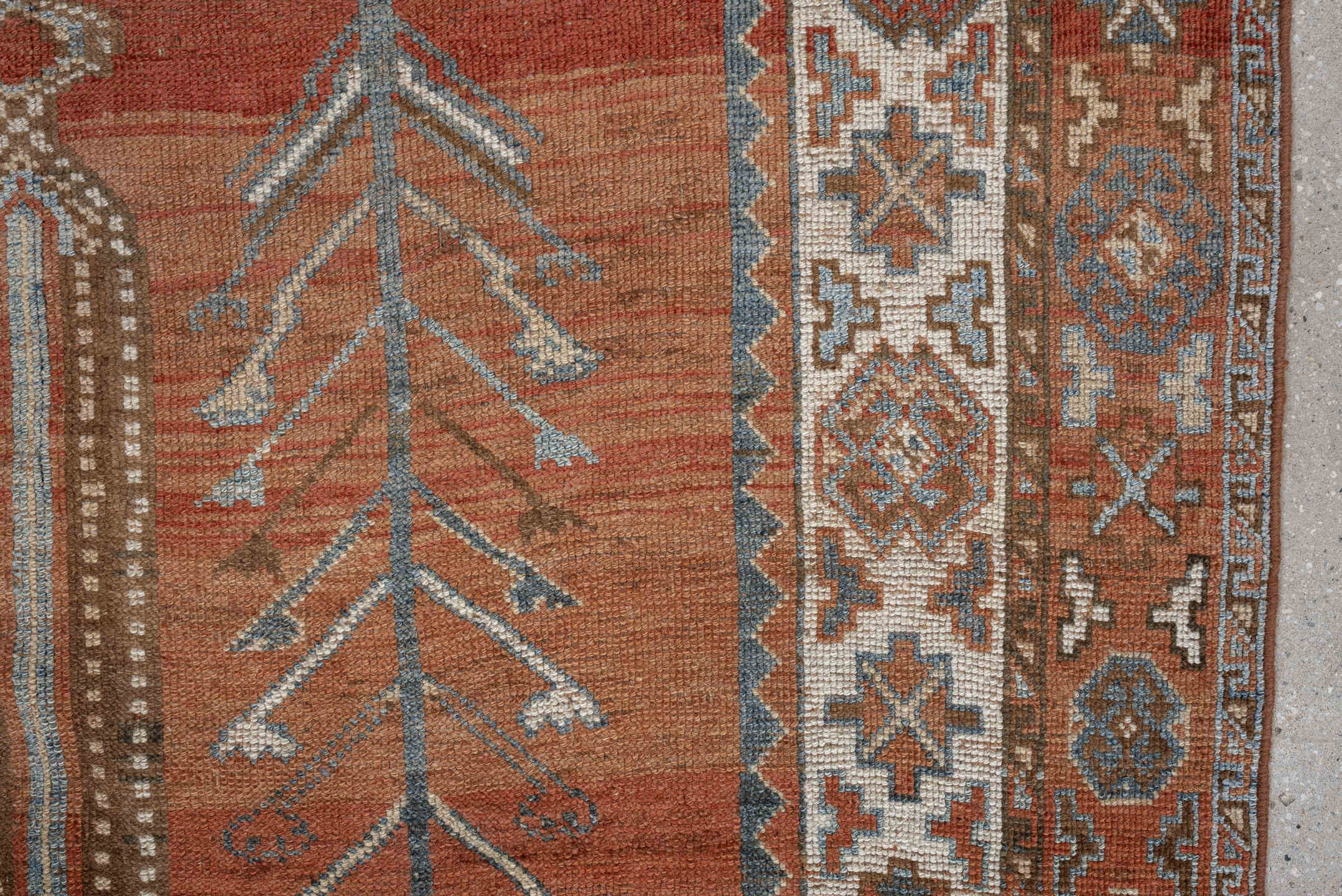5' x 9' one-of-a-kind handmade antique Kurd medium size rug. Color palette: terra cotta, ivory, sky blue, brown, slate, rust