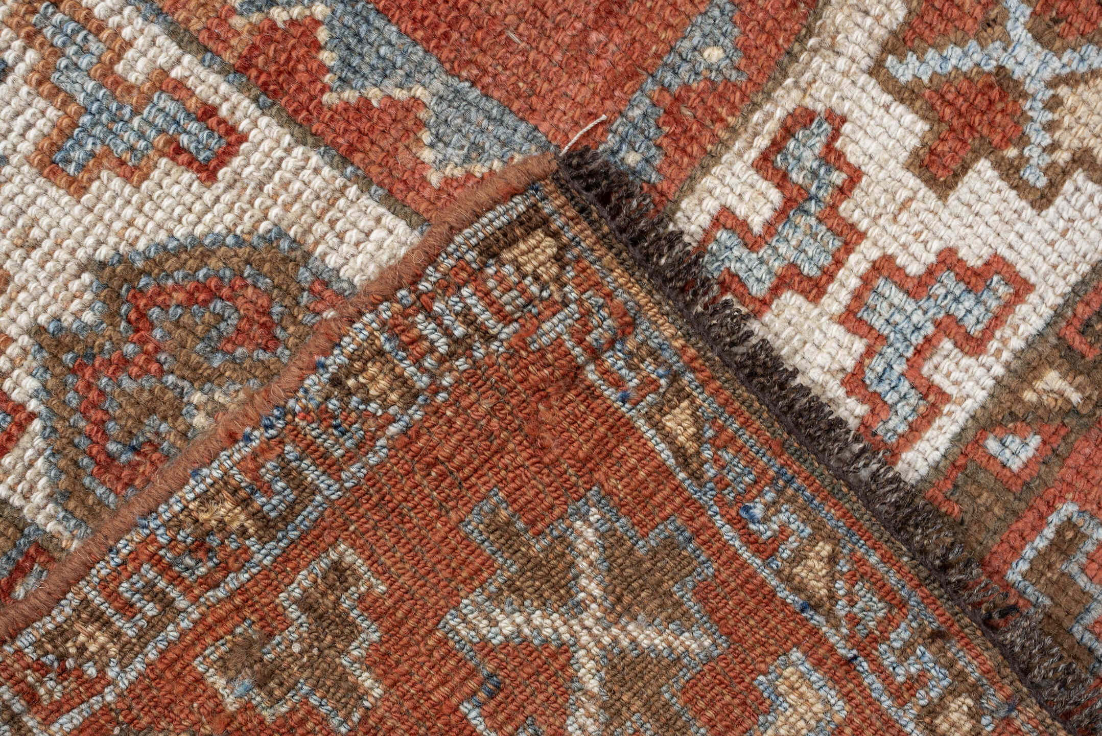 5' x 9' one-of-a-kind handmade antique Kurd medium size rug. Color palette: terra cotta, ivory, sky blue, brown, slate, rust