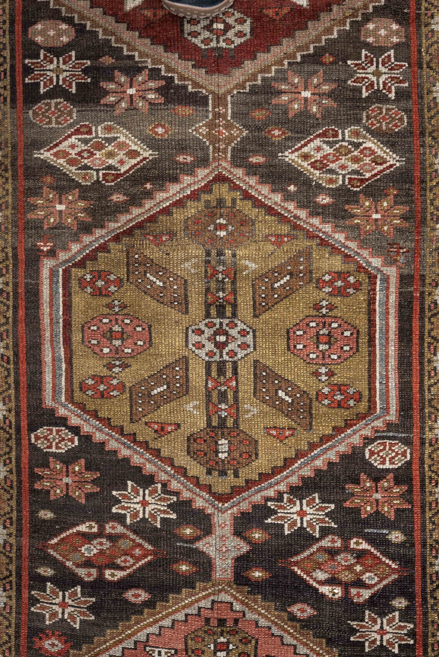 3' x 12' one-of-a-kind handmade antique Kurd runner rug. Color palette: brown, ivory, rust, camel, taupe, burgundy, olive