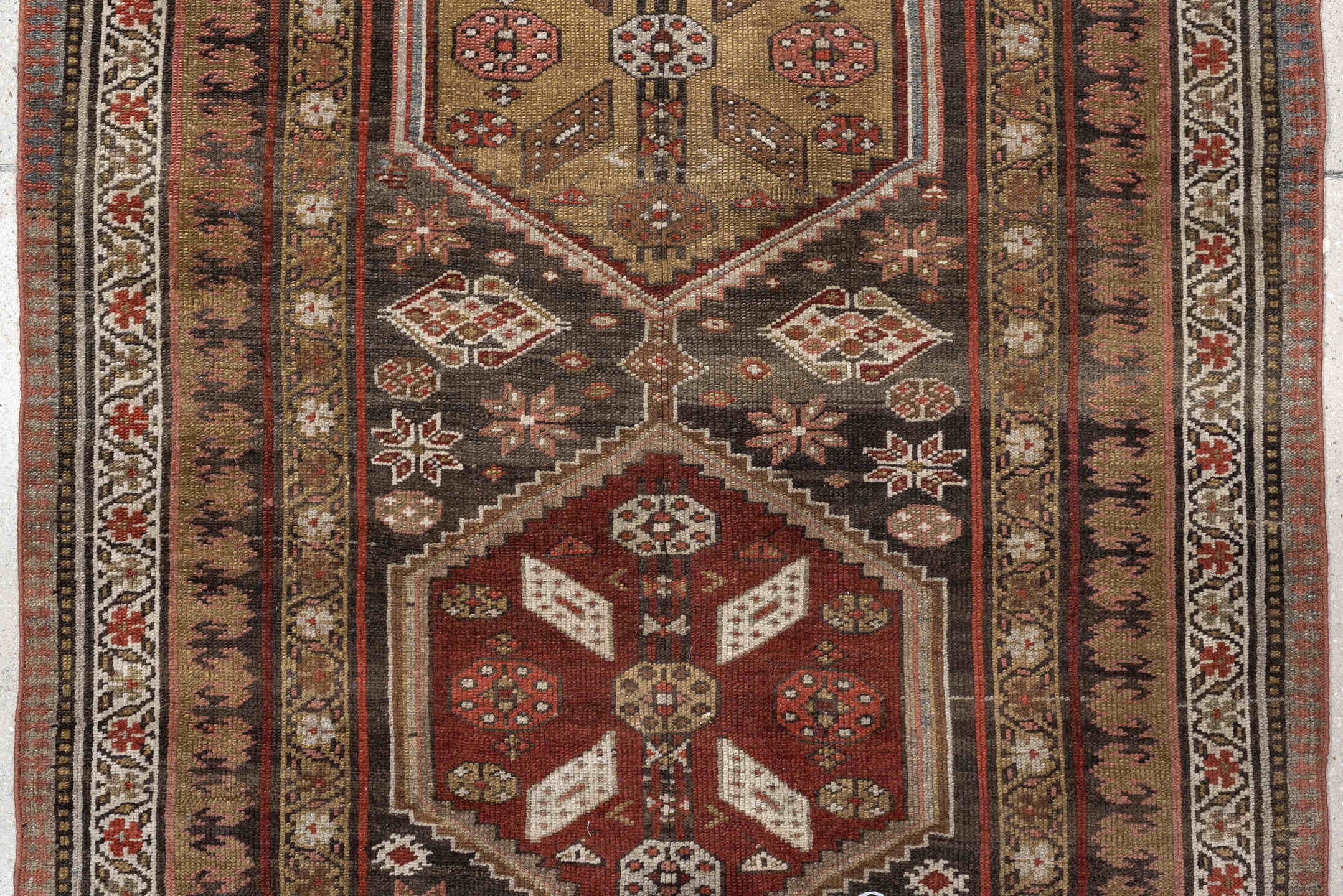 3' x 12' one-of-a-kind handmade antique Kurd runner rug. Color palette: brown, ivory, rust, camel, taupe, burgundy, olive