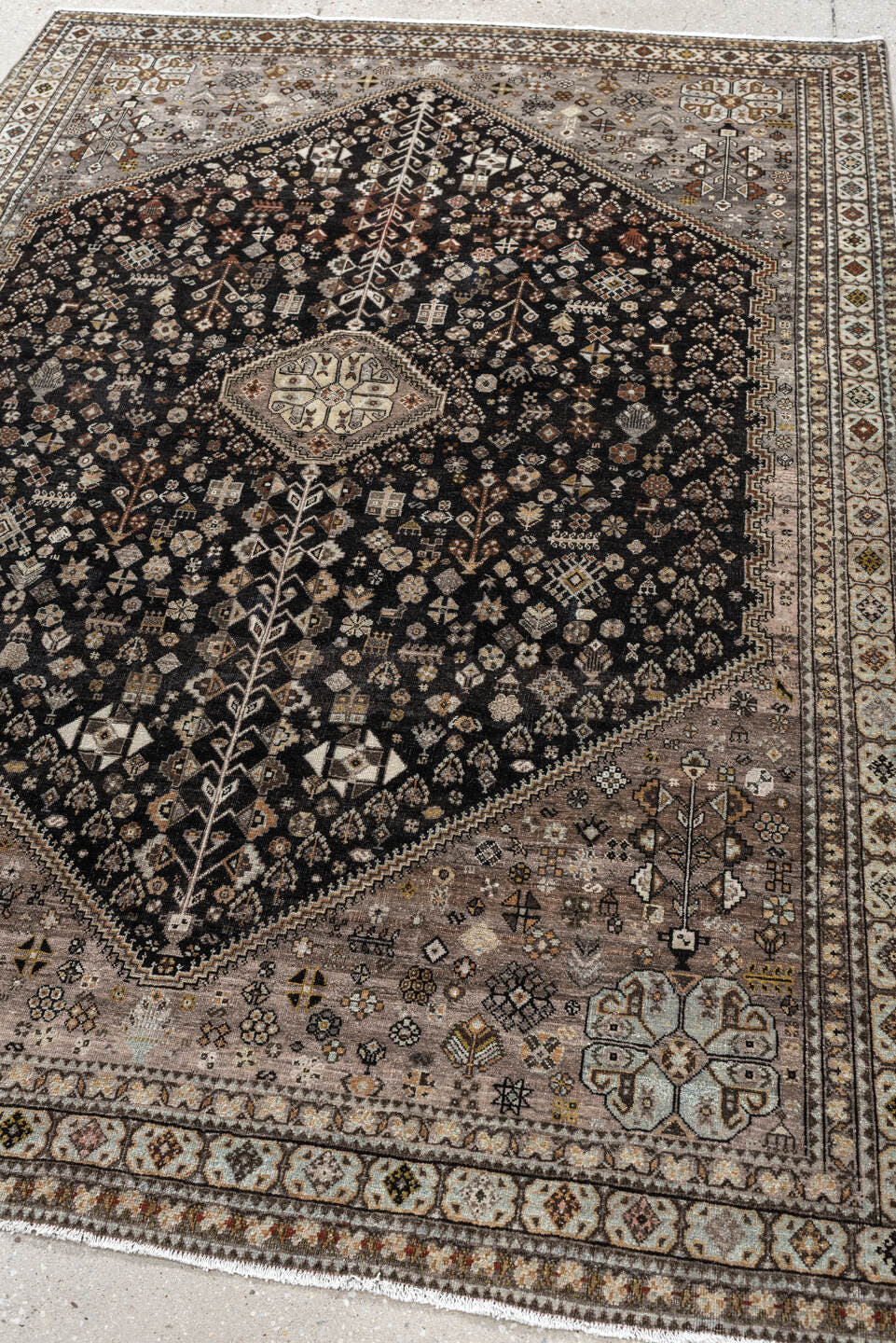 5' x 6' one-of-a-kind handmade antique Afshar rug. Color palette: charcoal, ivory, taupe, rust, pale blue, brown, camel