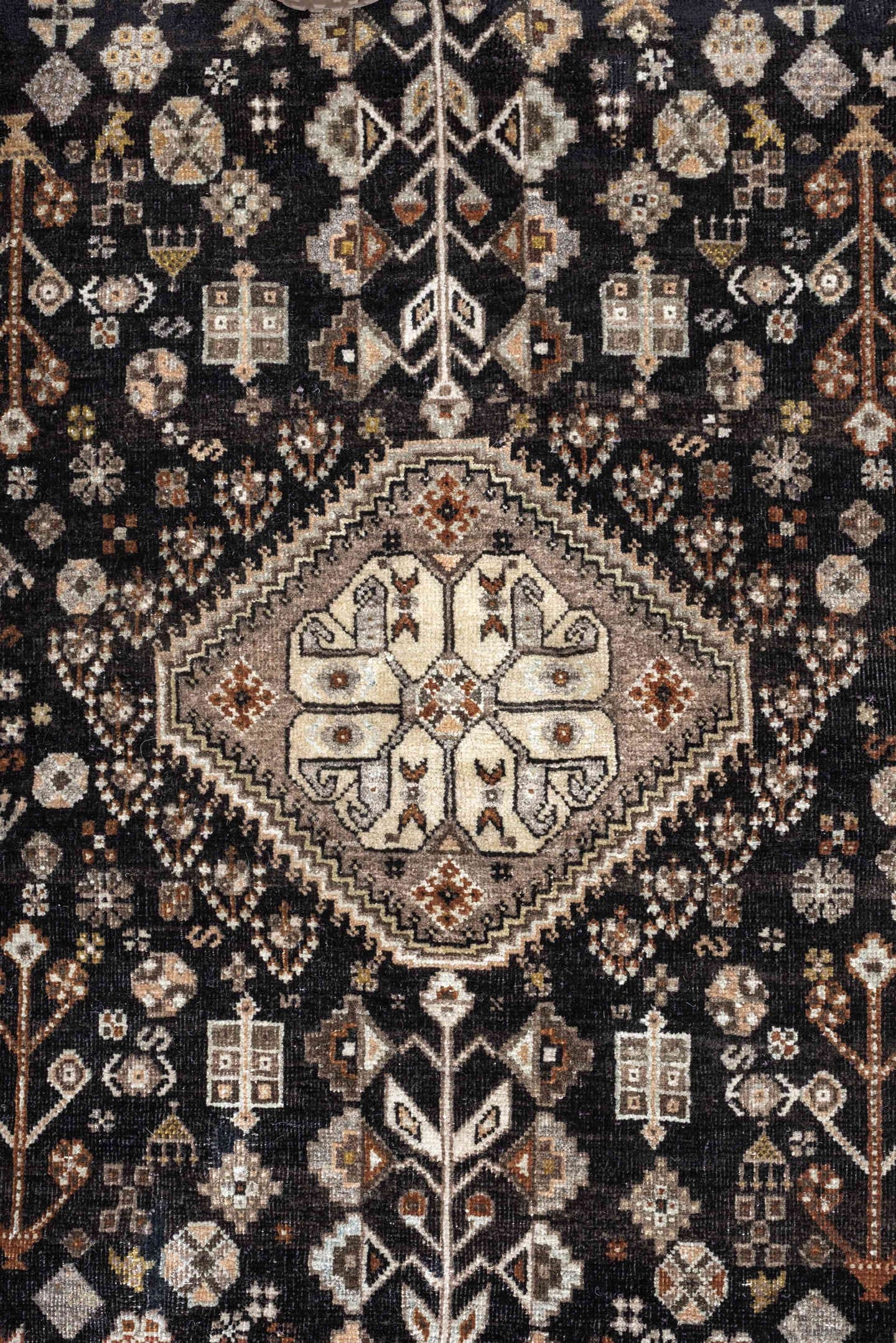 5' x 6' one-of-a-kind handmade antique Afshar rug. Color palette: charcoal, ivory, taupe, rust, pale blue, brown, camel