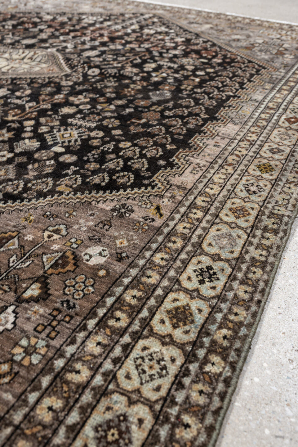 5' x 6' one-of-a-kind handmade antique Afshar rug. Color palette: charcoal, ivory, taupe, rust, pale blue, brown, camel