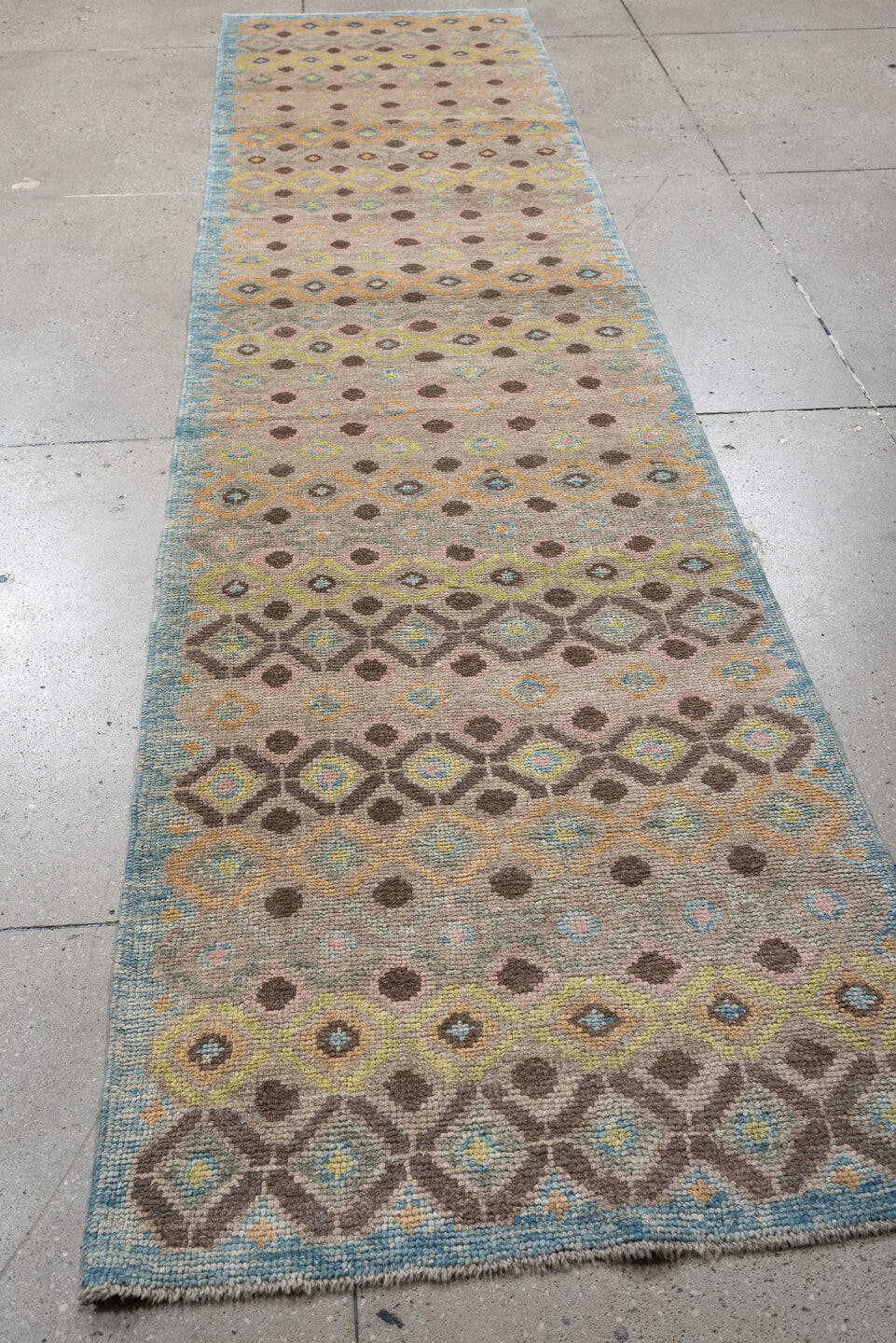 2' x 11' one-of-a-kind handmade vintage Oushak runner rug. Color palette: taupe, sky blue, camel, brown, ivory, sage, gold