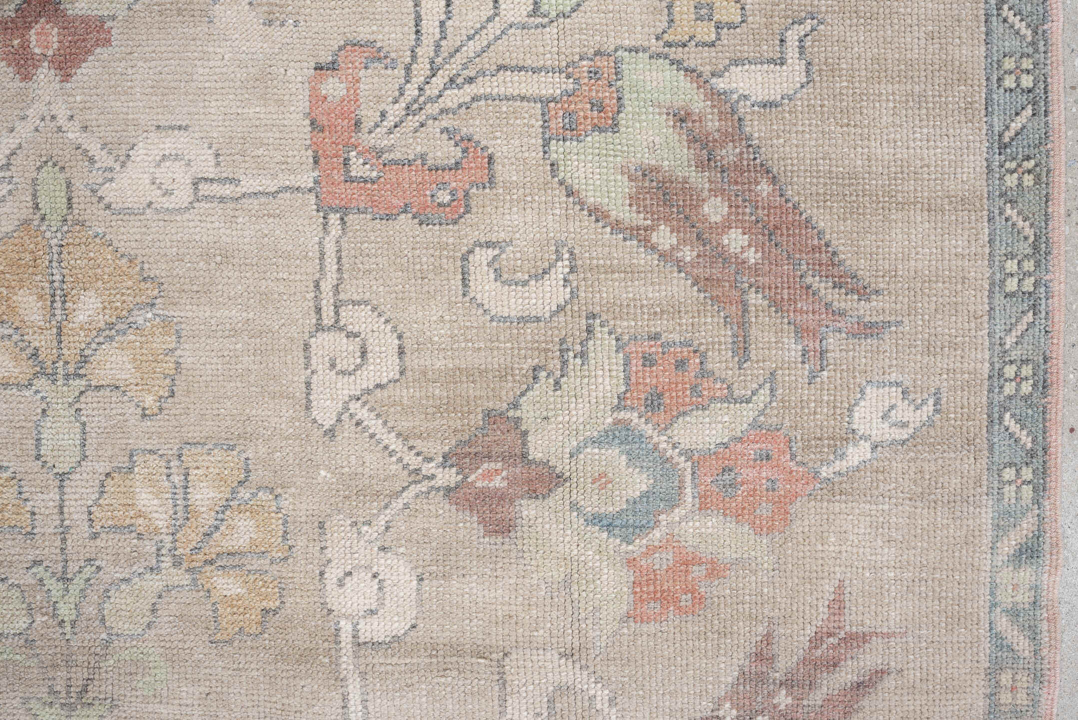 4' x 8' one-of-a-kind handmade antique Oushak rug. Color palette: taupe, ivory, pale blue, coral, soft gold, rose, sage