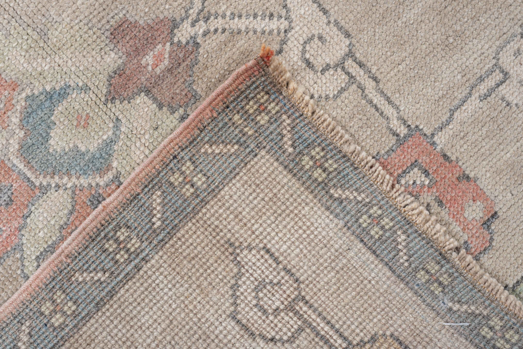 4' x 8' one-of-a-kind handmade antique Oushak rug. Color palette: taupe, ivory, pale blue, coral, soft gold, rose, sage