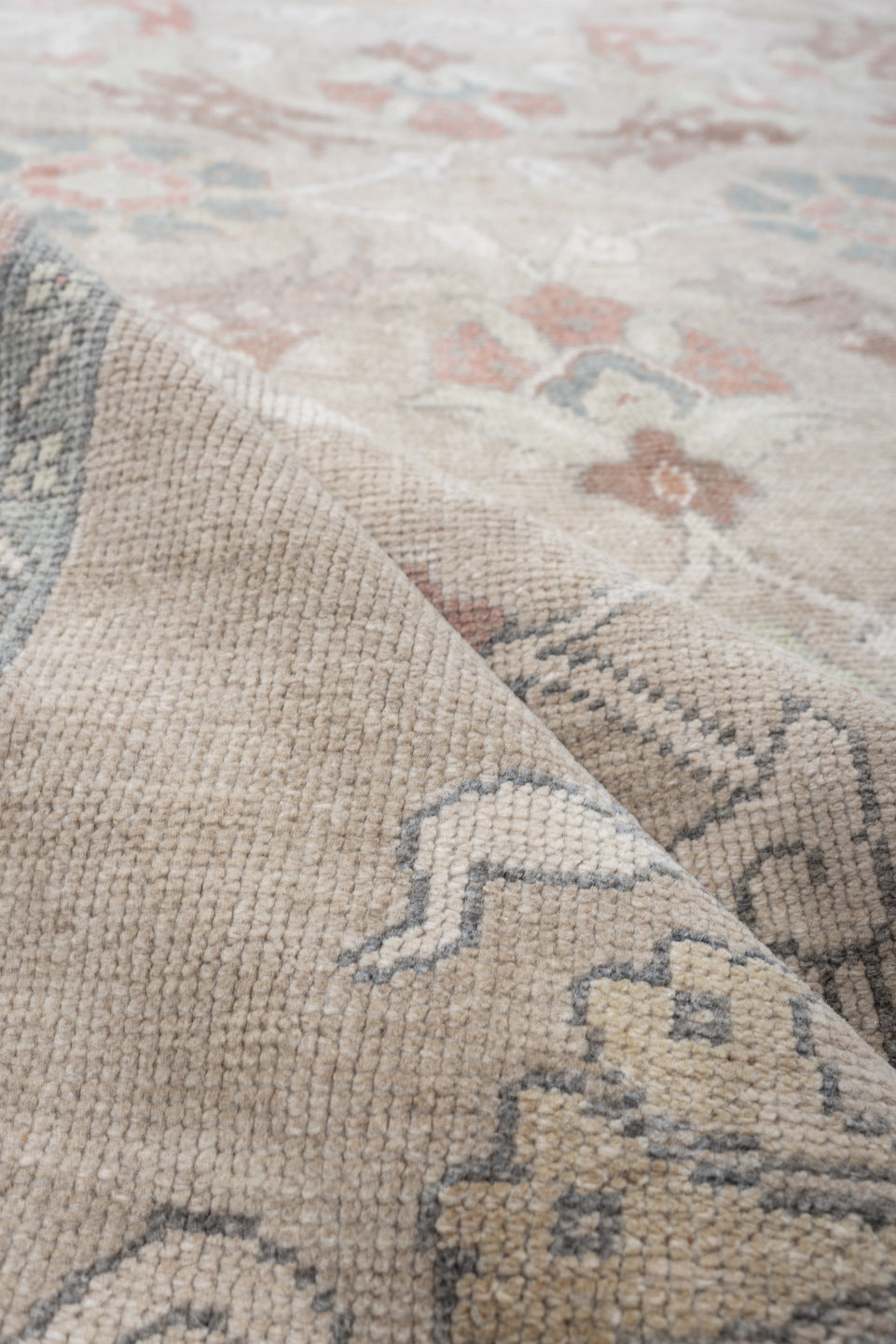 4' x 8' one-of-a-kind handmade antique Oushak rug. Color palette: taupe, ivory, pale blue, coral, soft gold, rose, sage