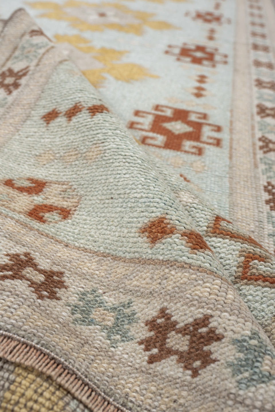2' x 8' one-of-a-kind handmade vintage Oushak runner rug. Color palette: pale blue, ivory, gold, rust, taupe, sage