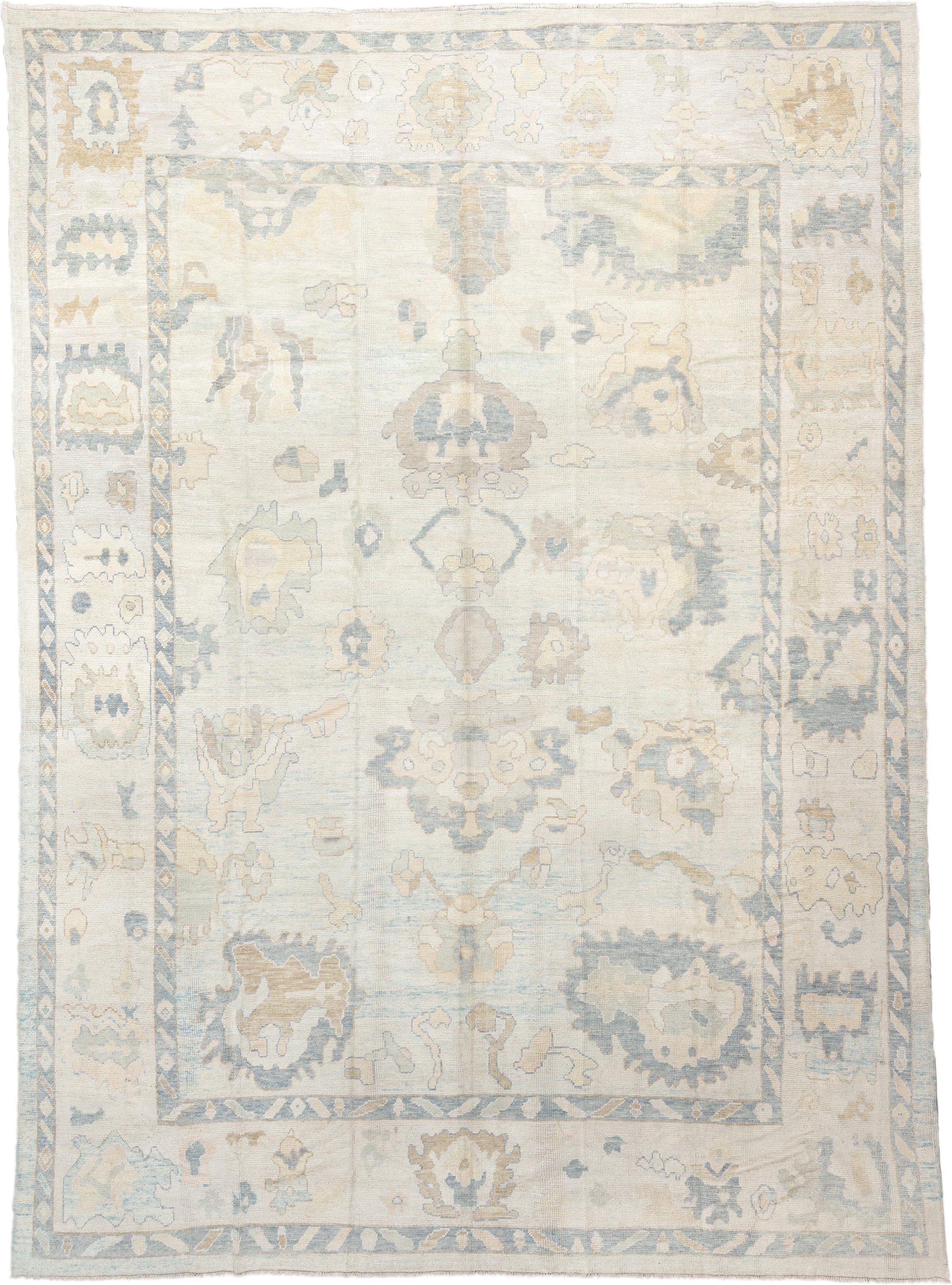 12' x 17' one-of-a-kind handmade vintage Oushak oversize rug. Color palette: ivory, pale blue, beige, taupe, cream, sage
