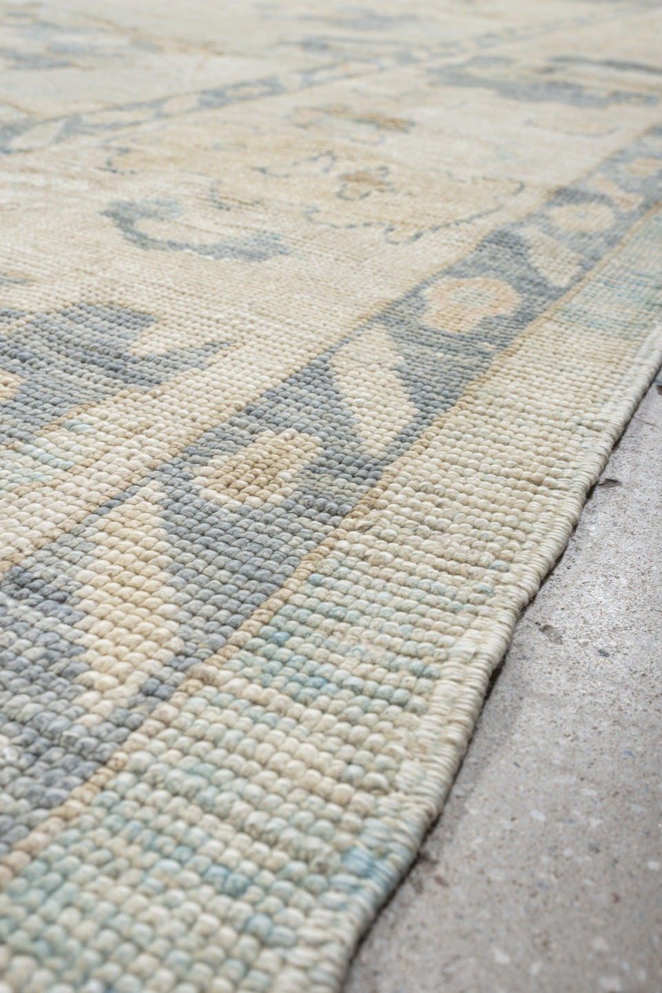 12' x 17' one-of-a-kind handmade vintage Oushak oversize rug. Color palette: ivory, pale blue, beige, taupe, cream, sage
