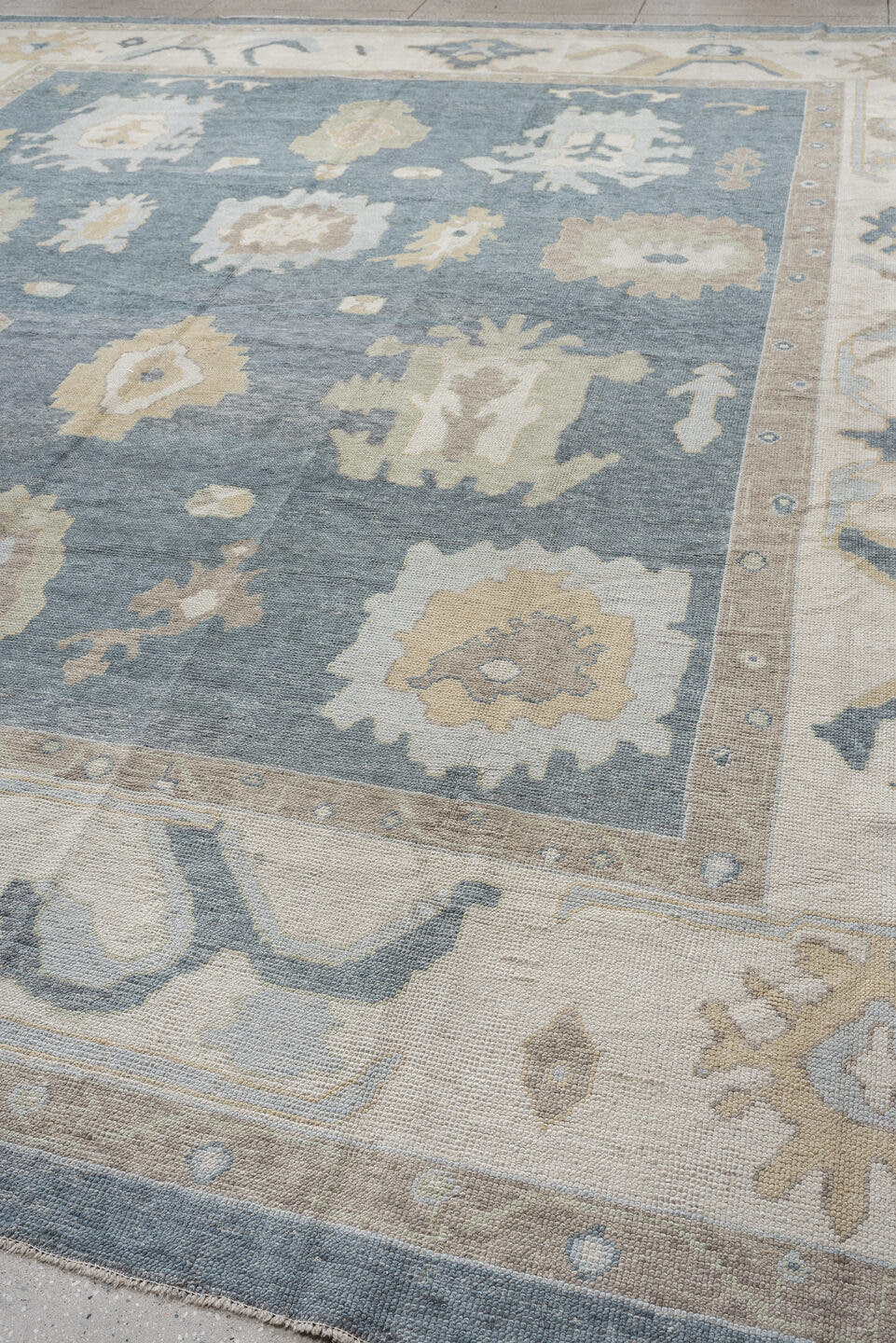 13' x 16' one-of-a-kind handmade vintage Oushak oversize rug. Color palette: blue, ivory, beige, taupe, sage, gold, gray
