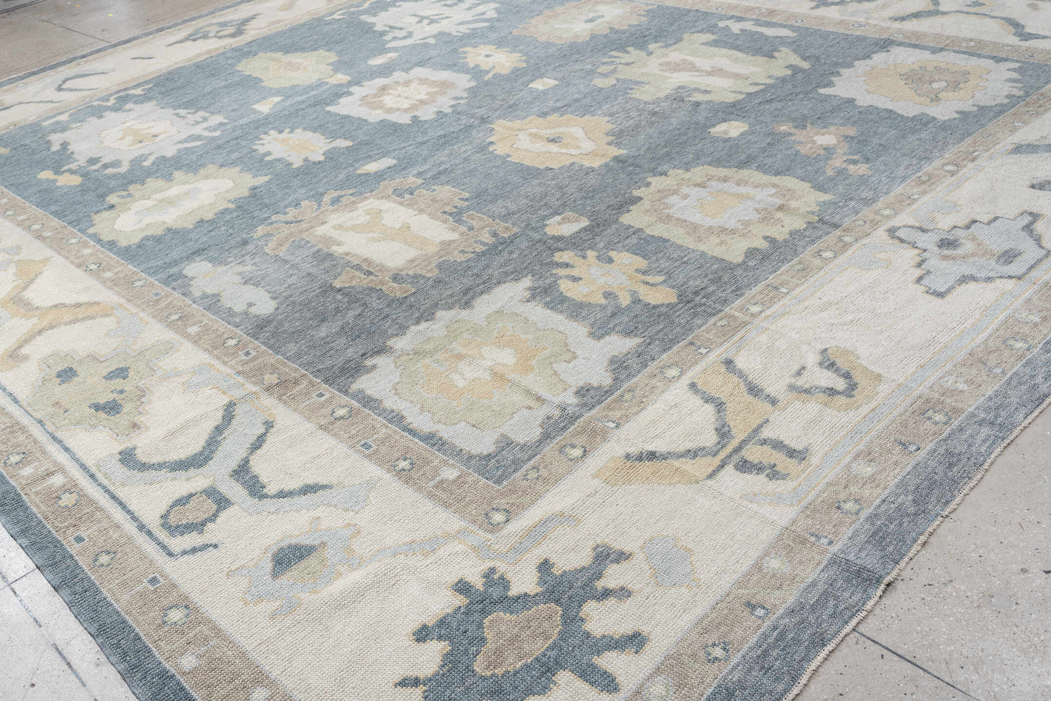 13' x 16' one-of-a-kind handmade vintage Oushak oversize rug. Color palette: blue, ivory, beige, taupe, sage, gold, gray