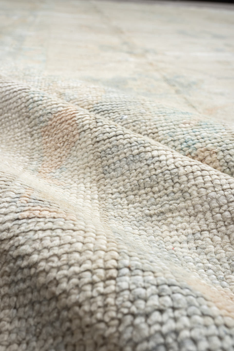 12' x 16' one-of-a-kind handmade vintage Oushak oversize rug. Color palette: ivory, pale blue, cream, taupe, blush, sage