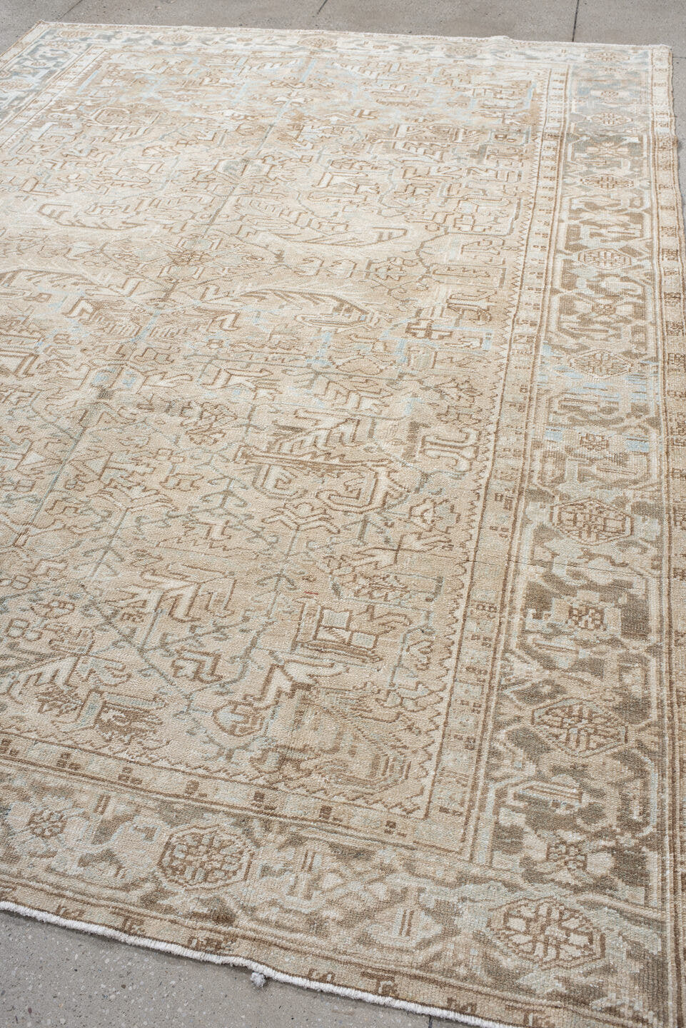 7' x 10' one-of-a-kind handmade vintage Heriz large size rug. Color palette: ivory, taupe, light blue, beige, camel, gray