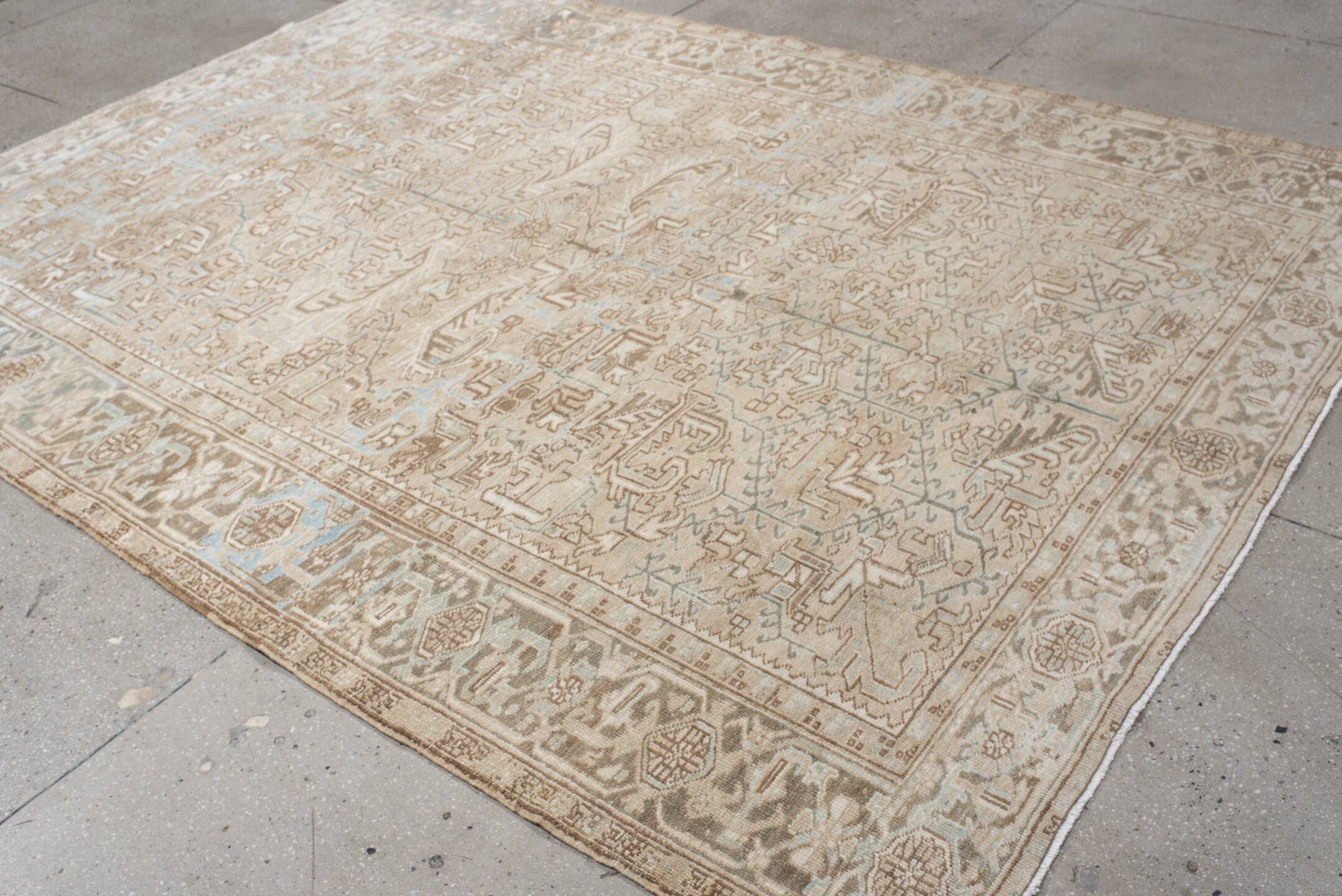 7' x 10' one-of-a-kind handmade vintage Heriz large size rug. Color palette: ivory, taupe, light blue, beige, camel, gray