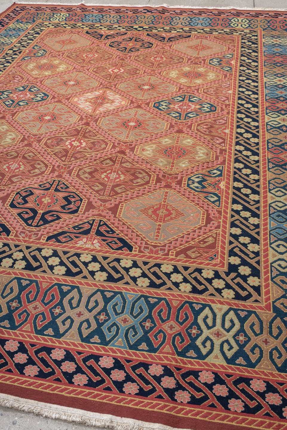 8' x 11' one-of-a-kind handmade vintage Sumak large size rug. Color palette: terra cotta, navy, ivory, sky blue, rust, rose